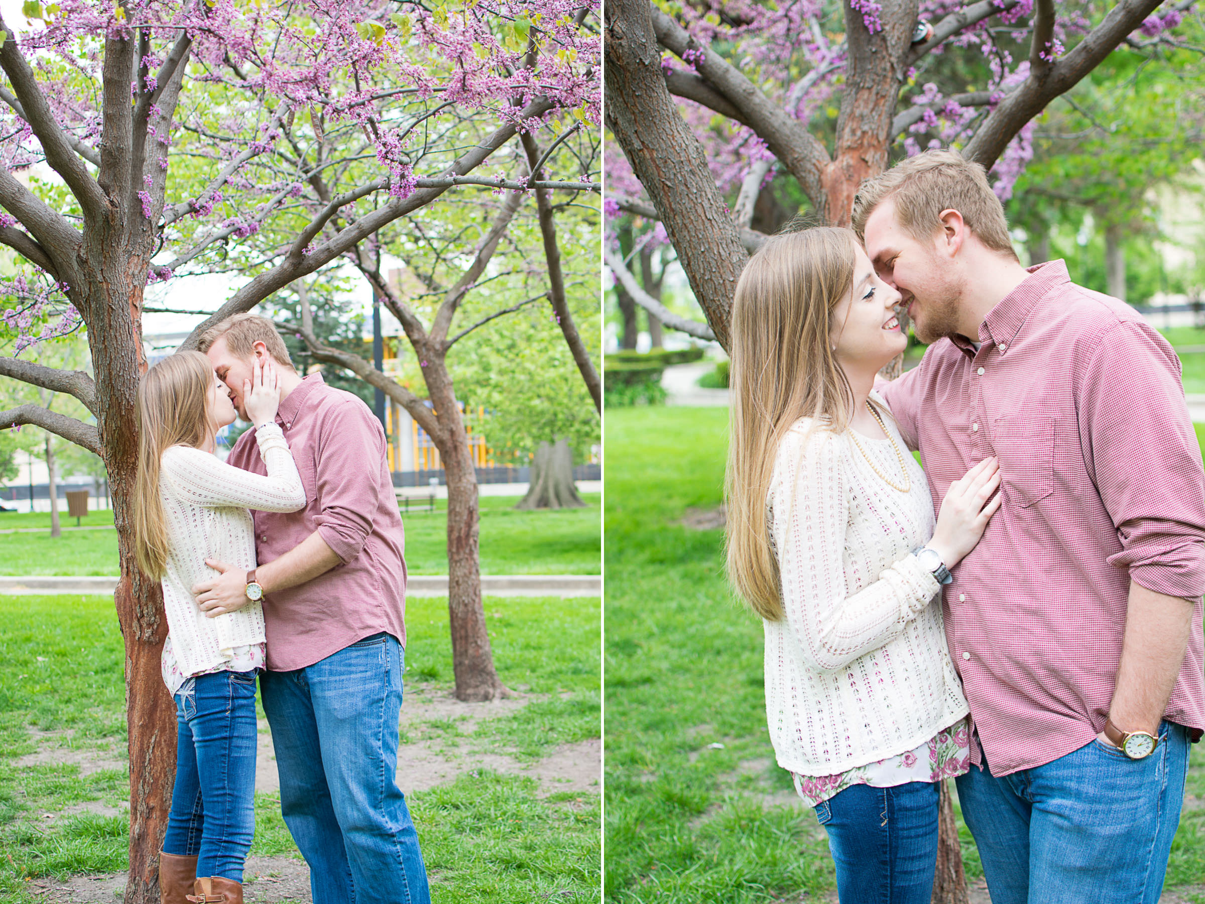 engaged couple kisses under blooming tree