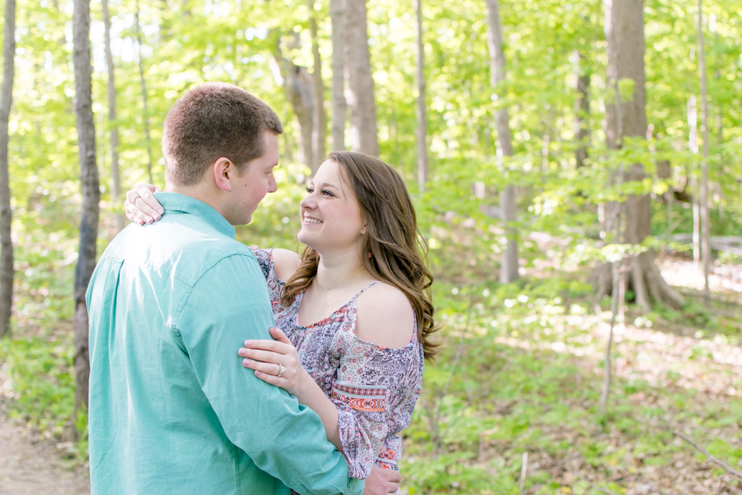 couple from Indianapolis laughs during engagement session