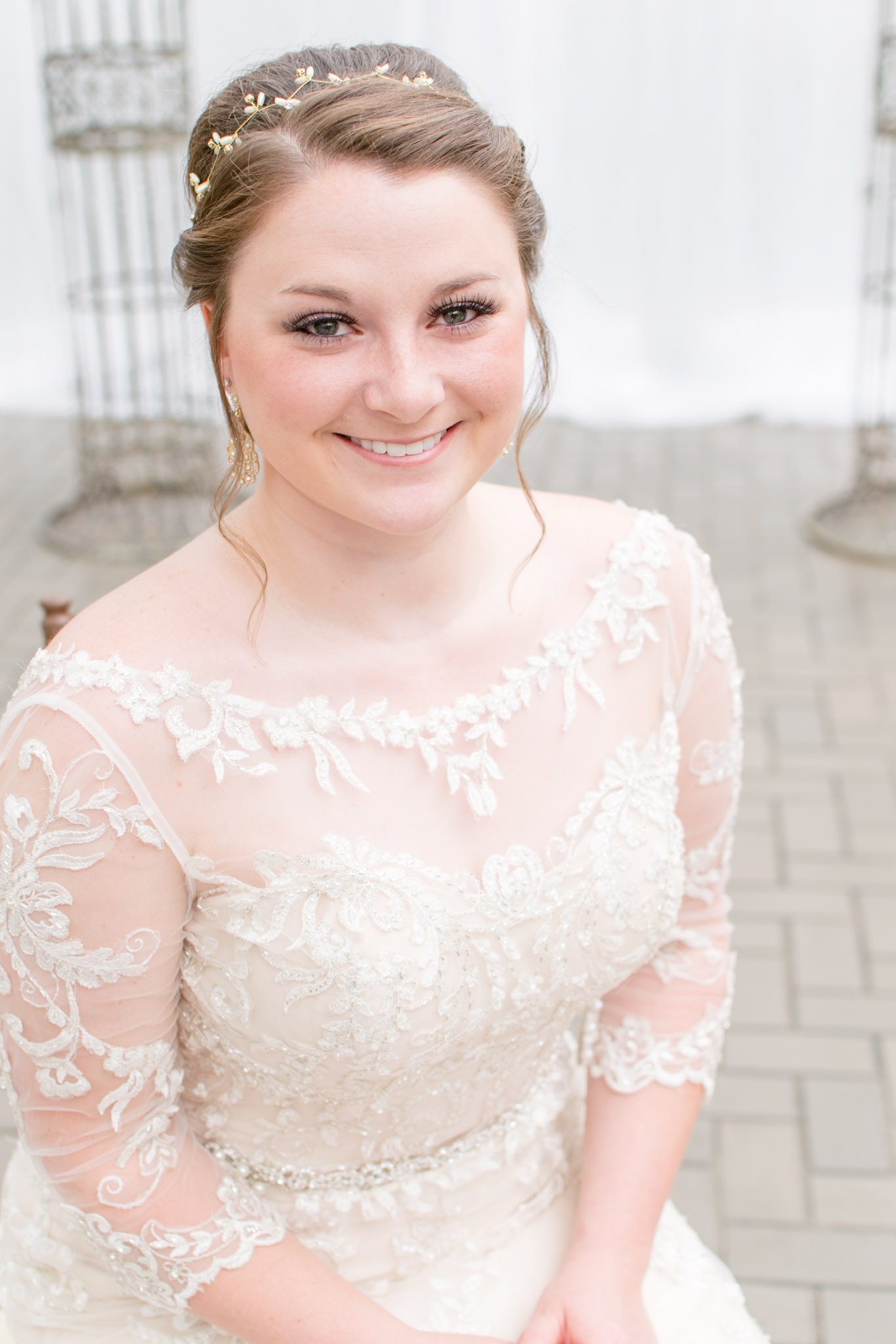 bride smiles at camera during wedding portraits