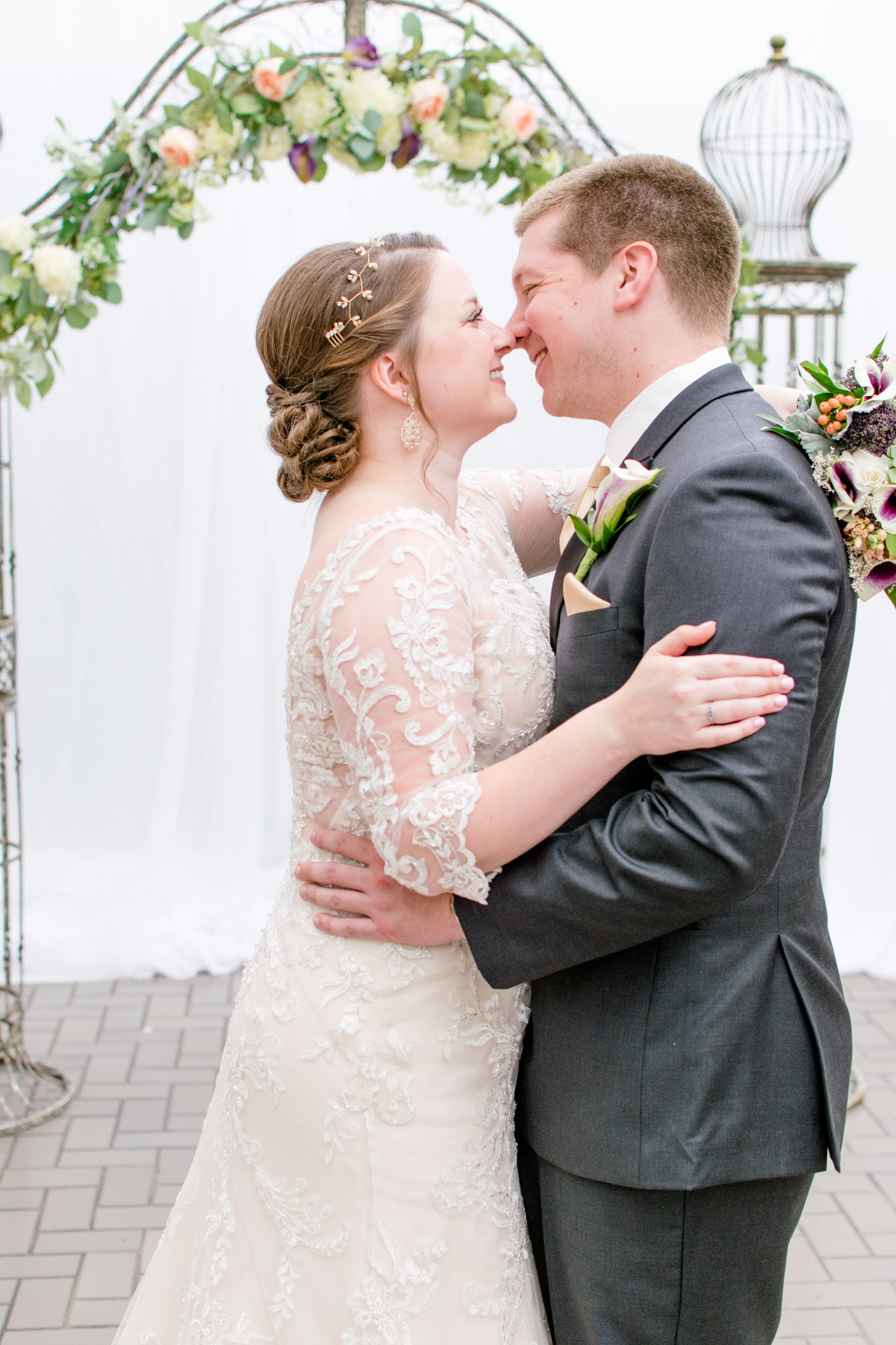 Indianapolis Bride and groom kiss on wedding day during portraits