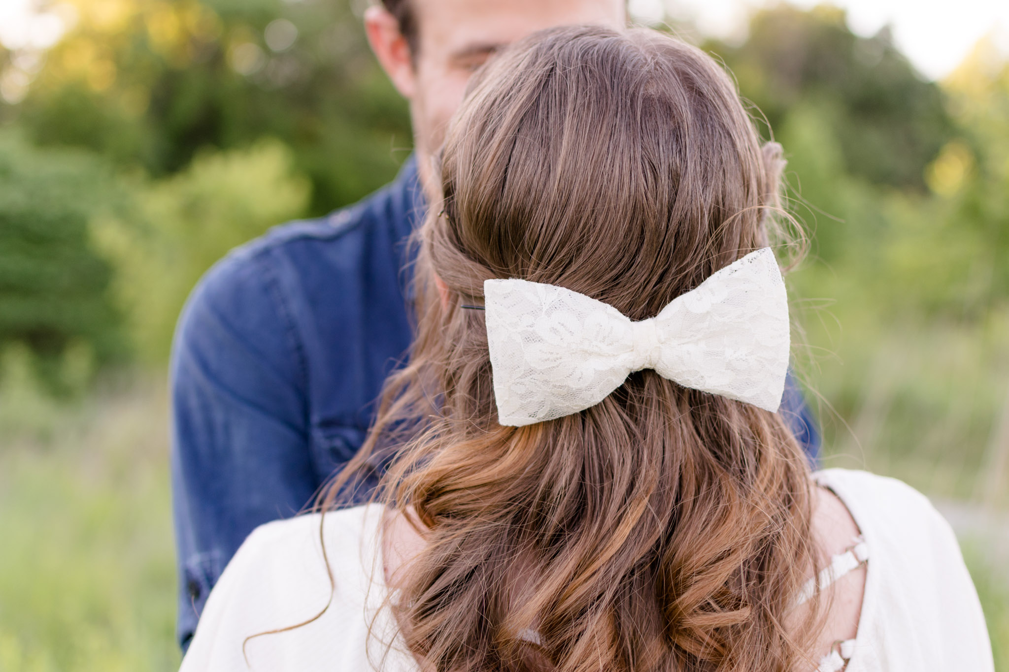 Bride-to-be wears a bow to her engagement session