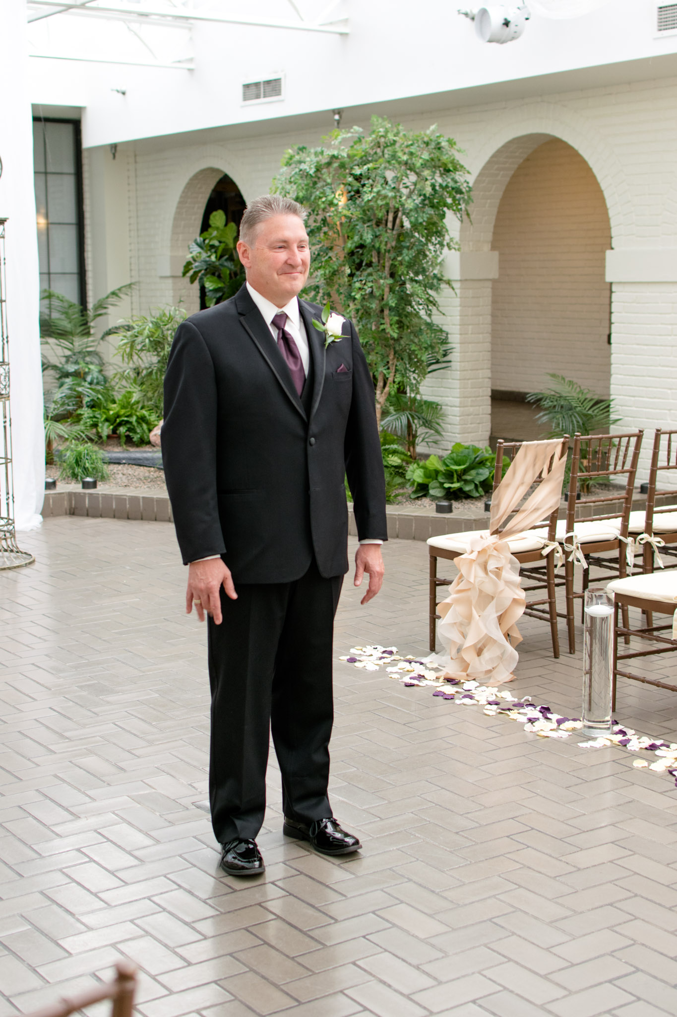 Father smiles during first look