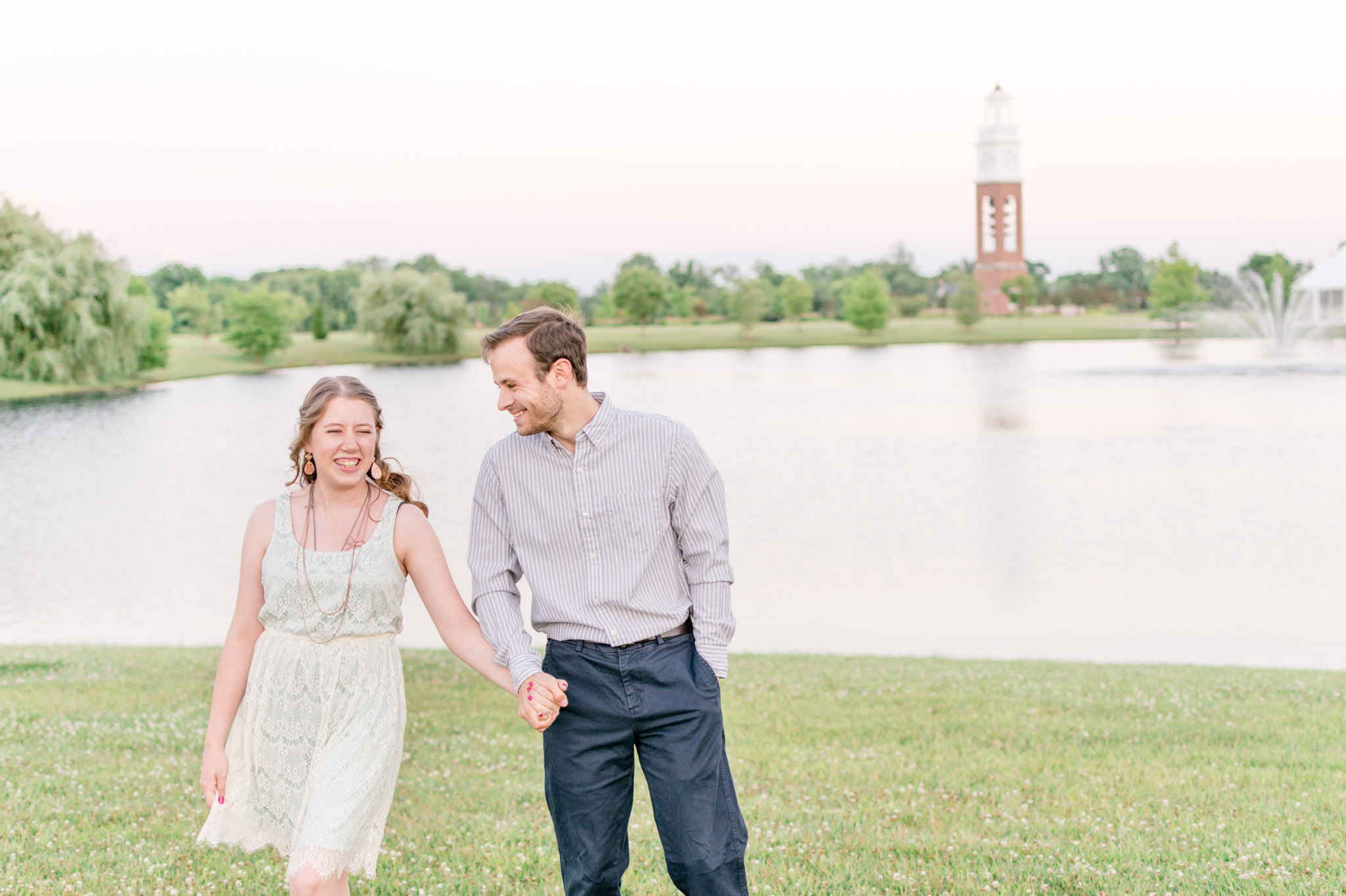 Couple laughs during Coxhall Gardens engagement session in Carmel, Indiana