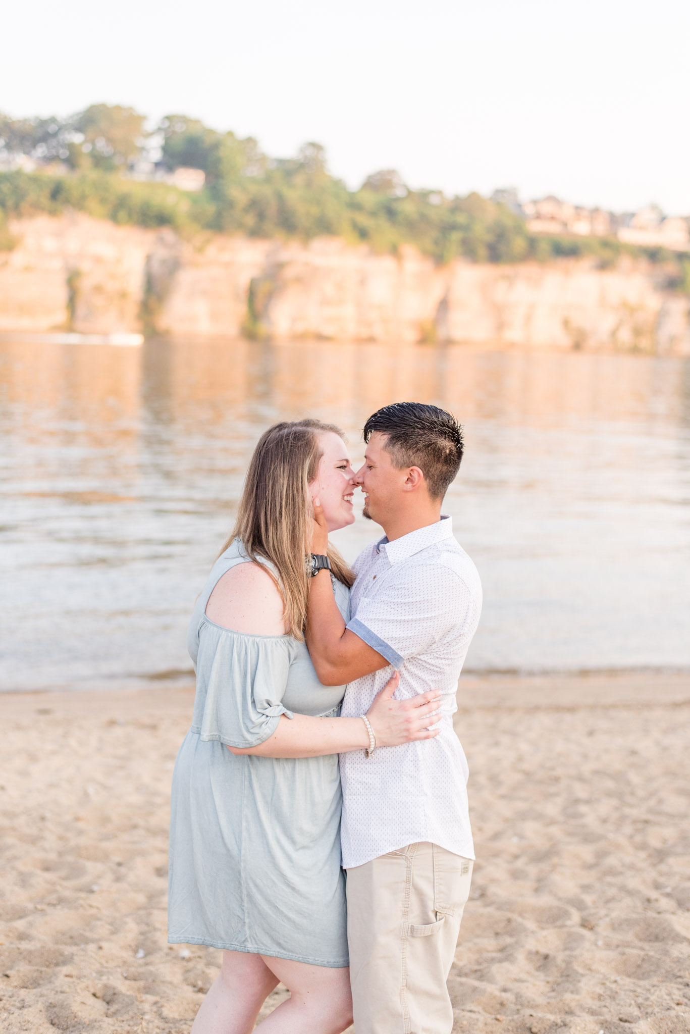 Couple giggles at McFarland Park in Florence Alabama during engagement session