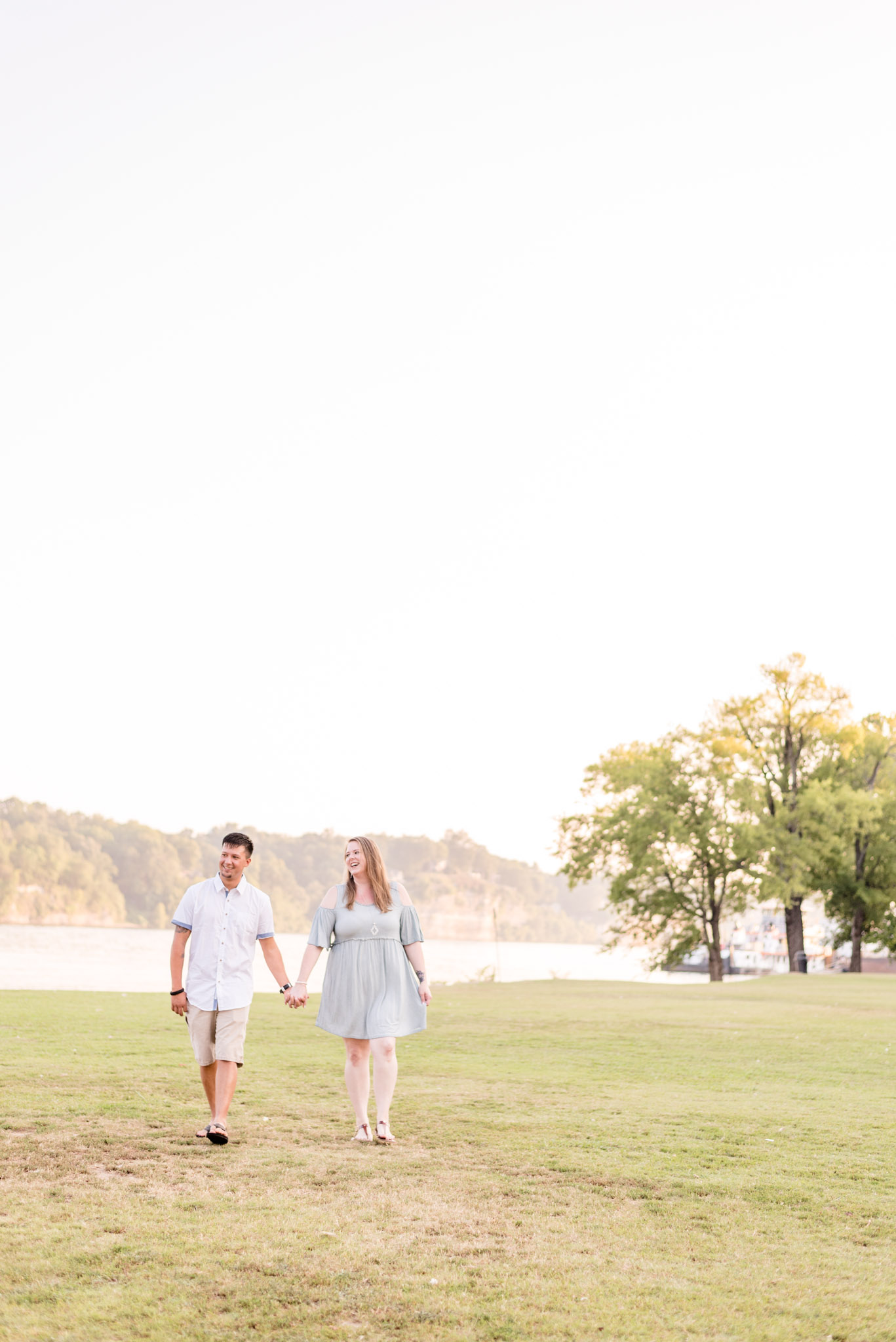 Couple laughs as they walk through McFarland Park