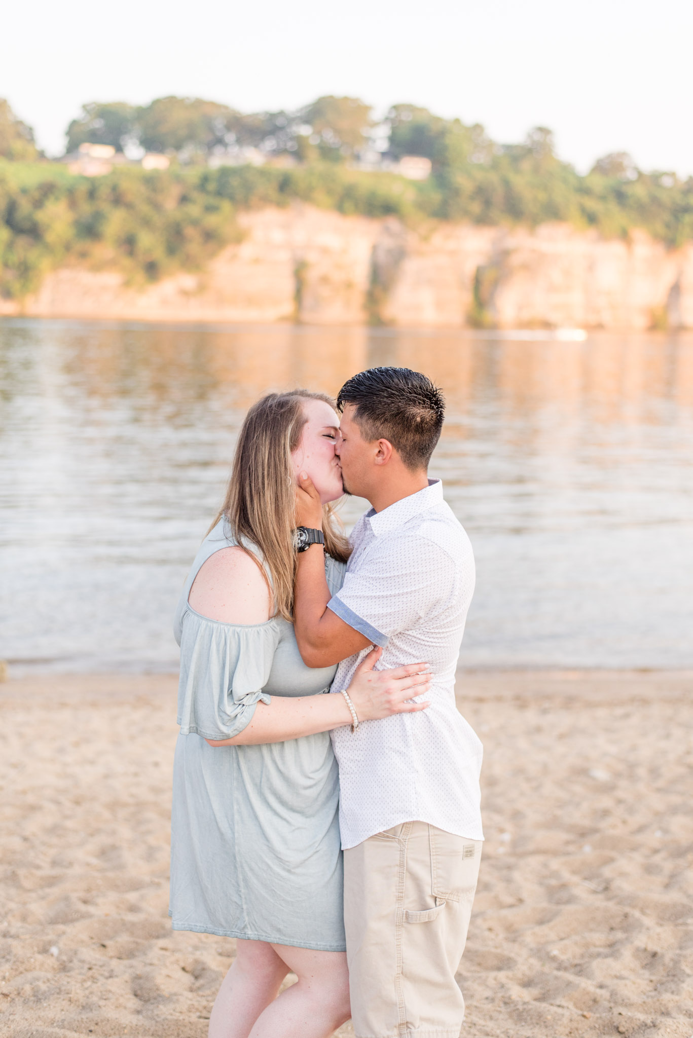 Couple kisses at McFarland Park in Florence Alabama during engagement session