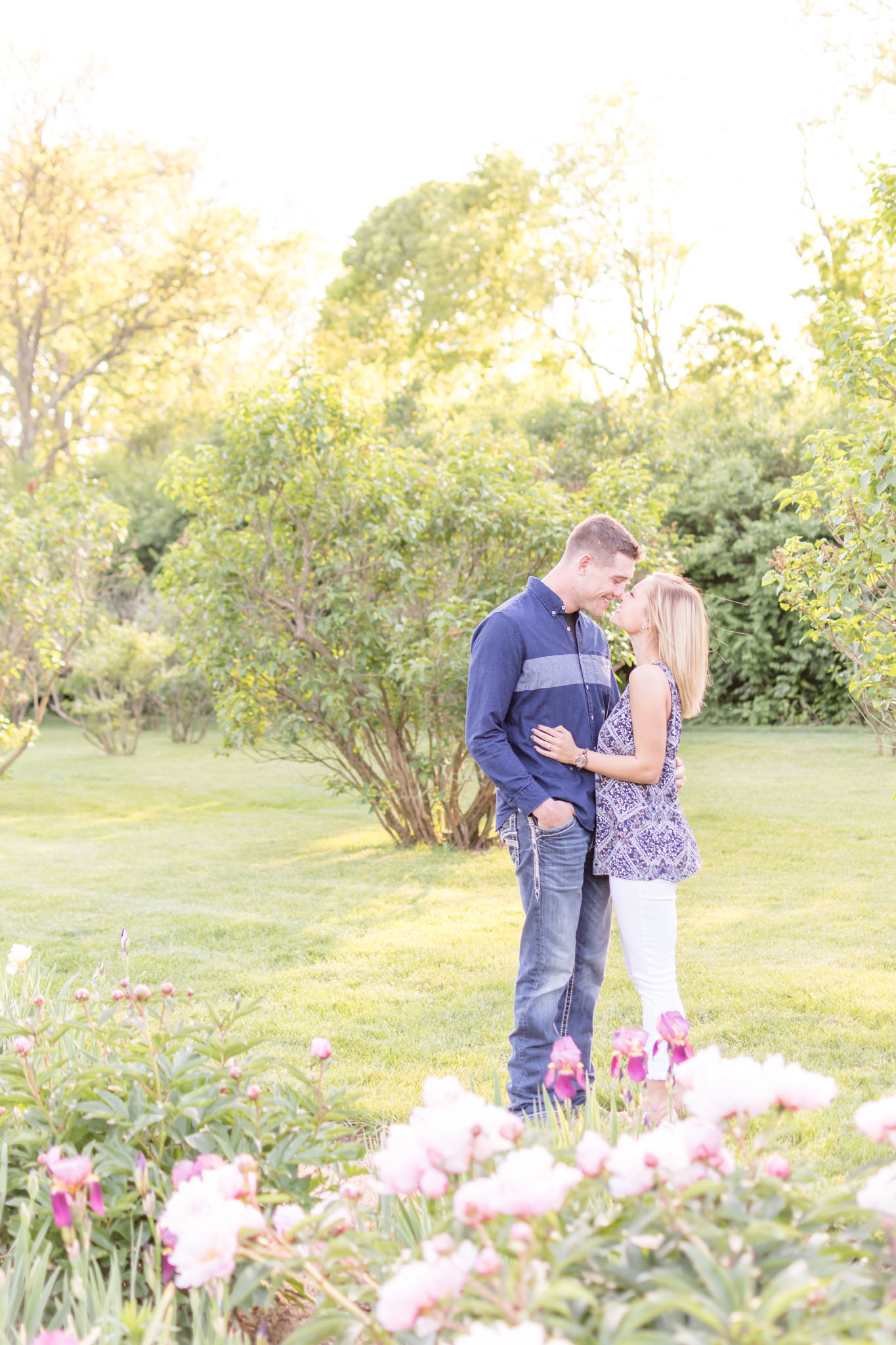 Bride and Groom kiss during Holcomb Gardens engagement session.