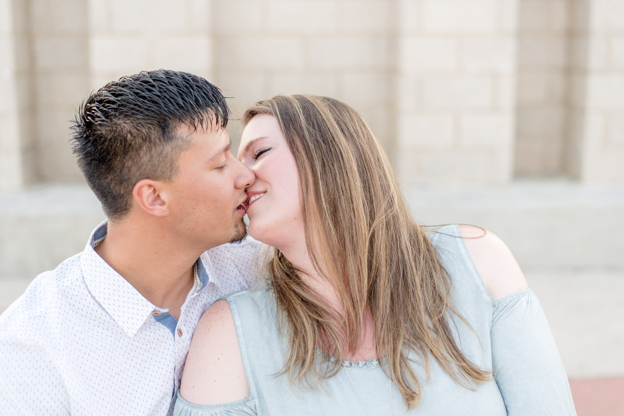 Engaged couple kisses in Florence-Alabama