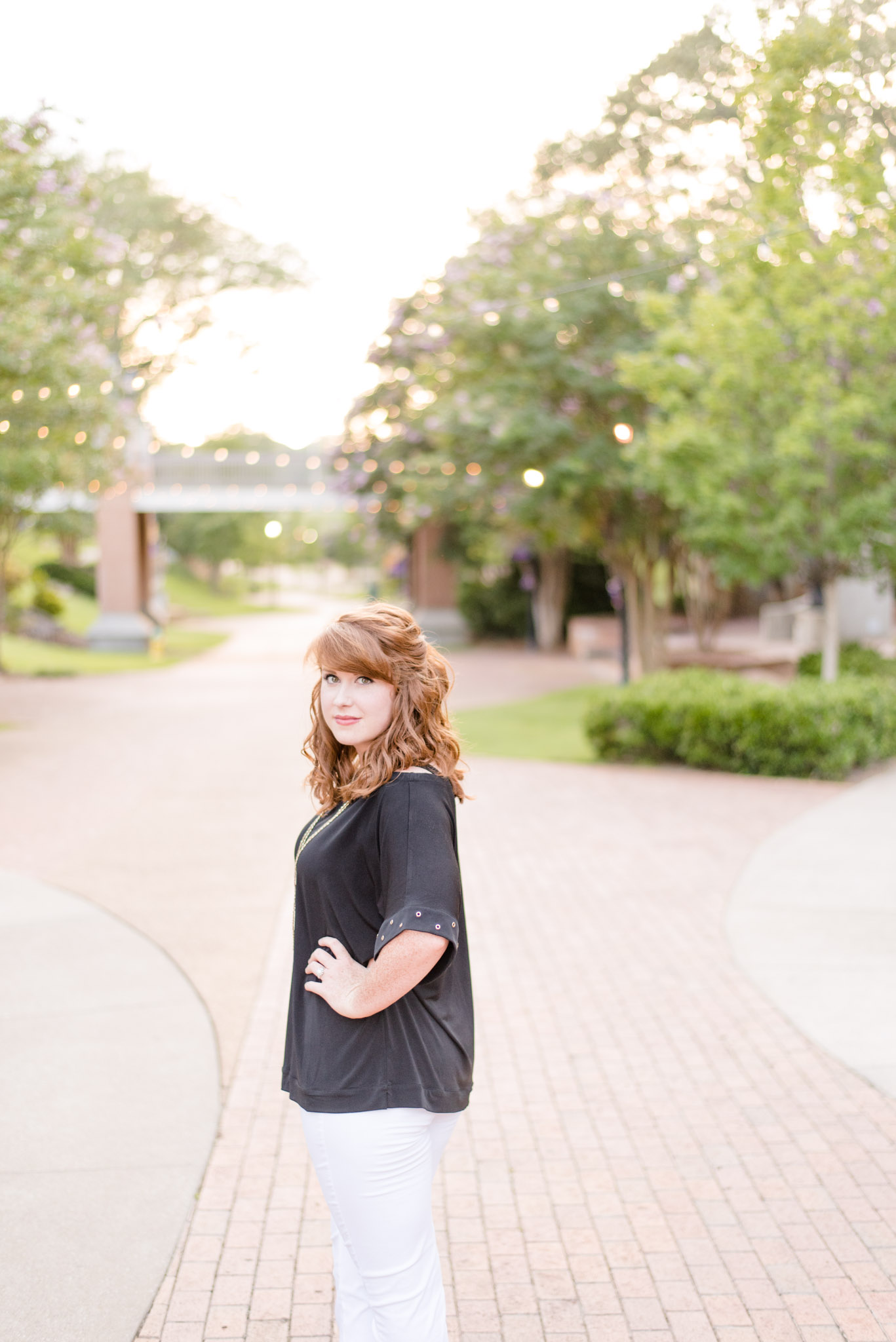 UNA graduate smiles during pictures