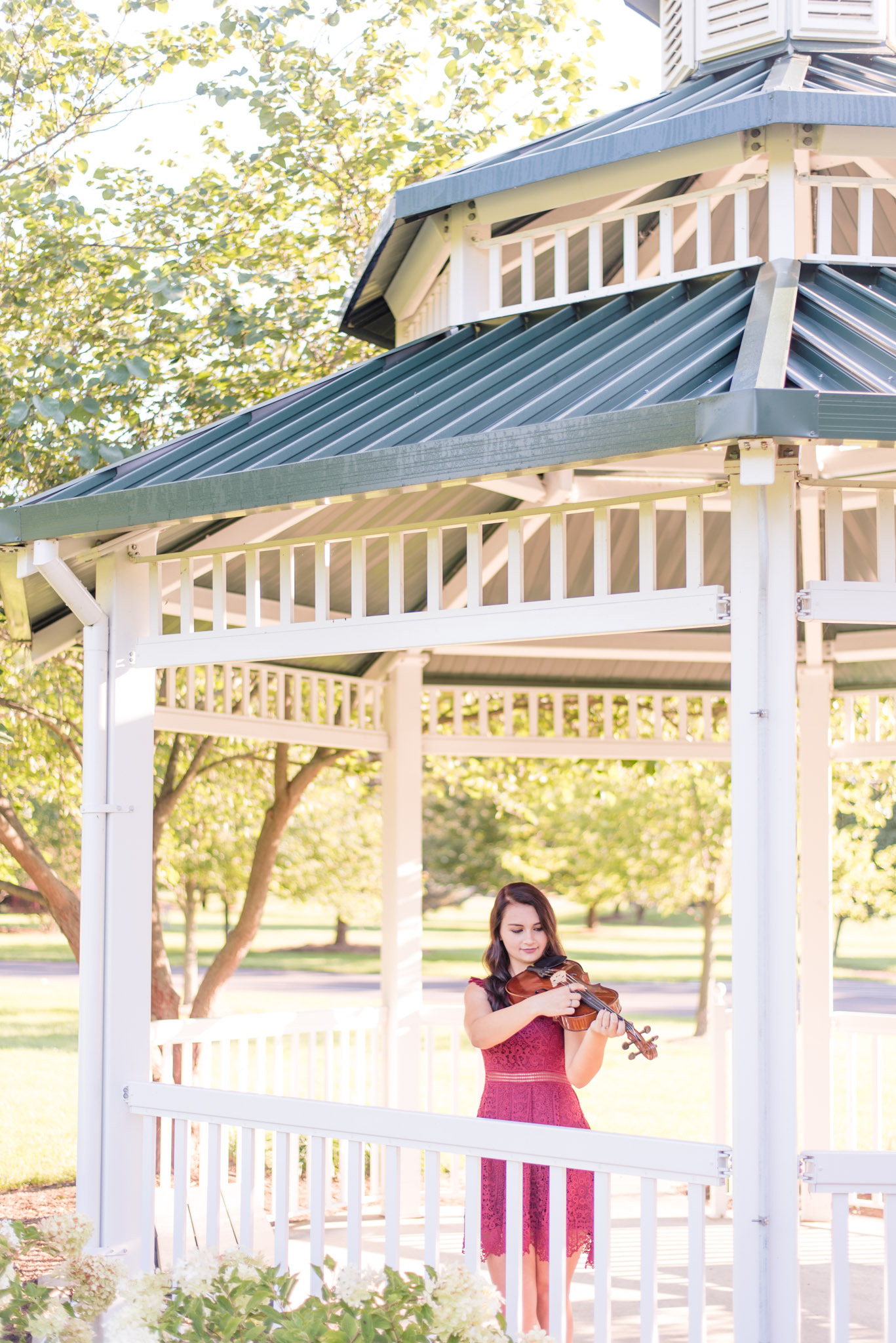 Avon senior plays viola under gazebo.