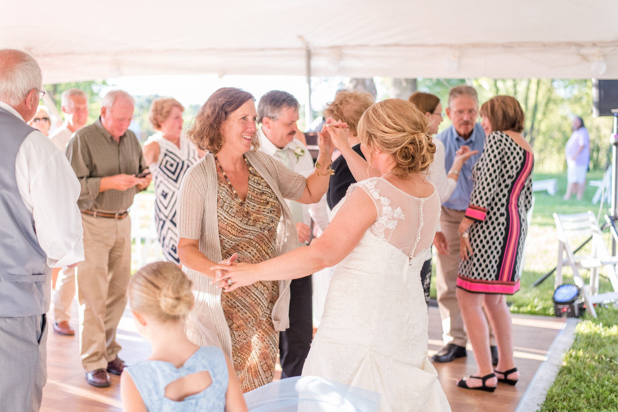 Bride and Guest Dance During Wedding Reception