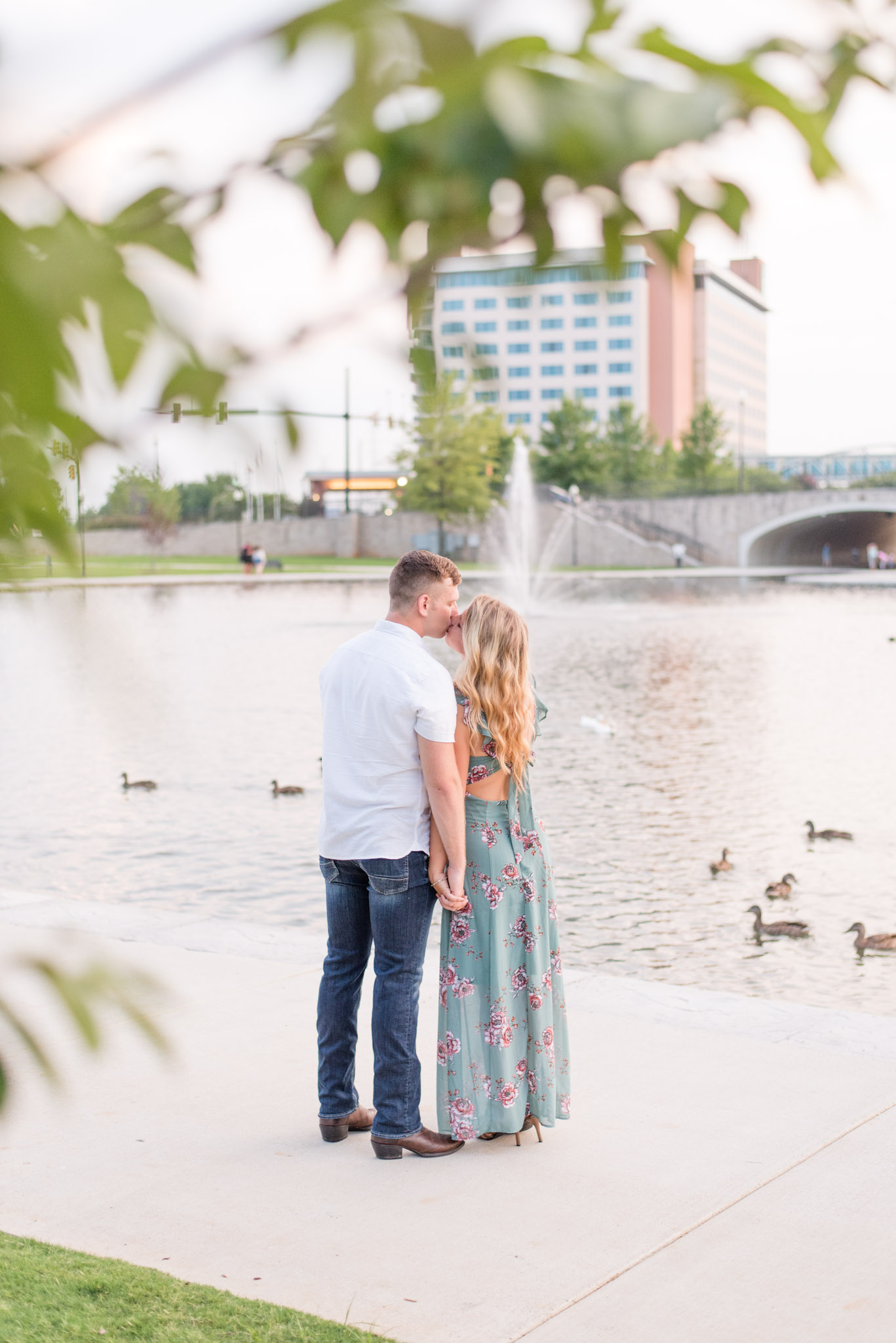 Couple Kisses in Front of Downtown Lake