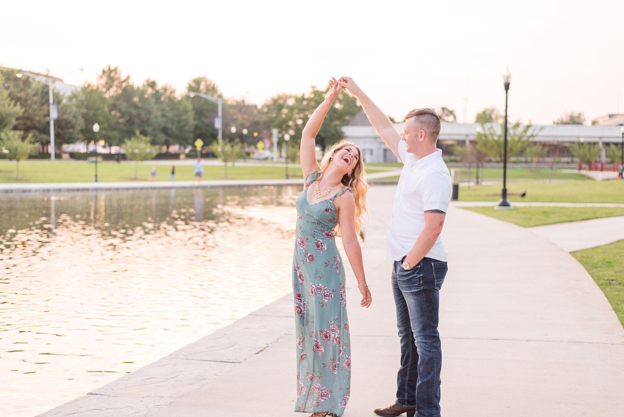 Bride twirls during engagement pictures.