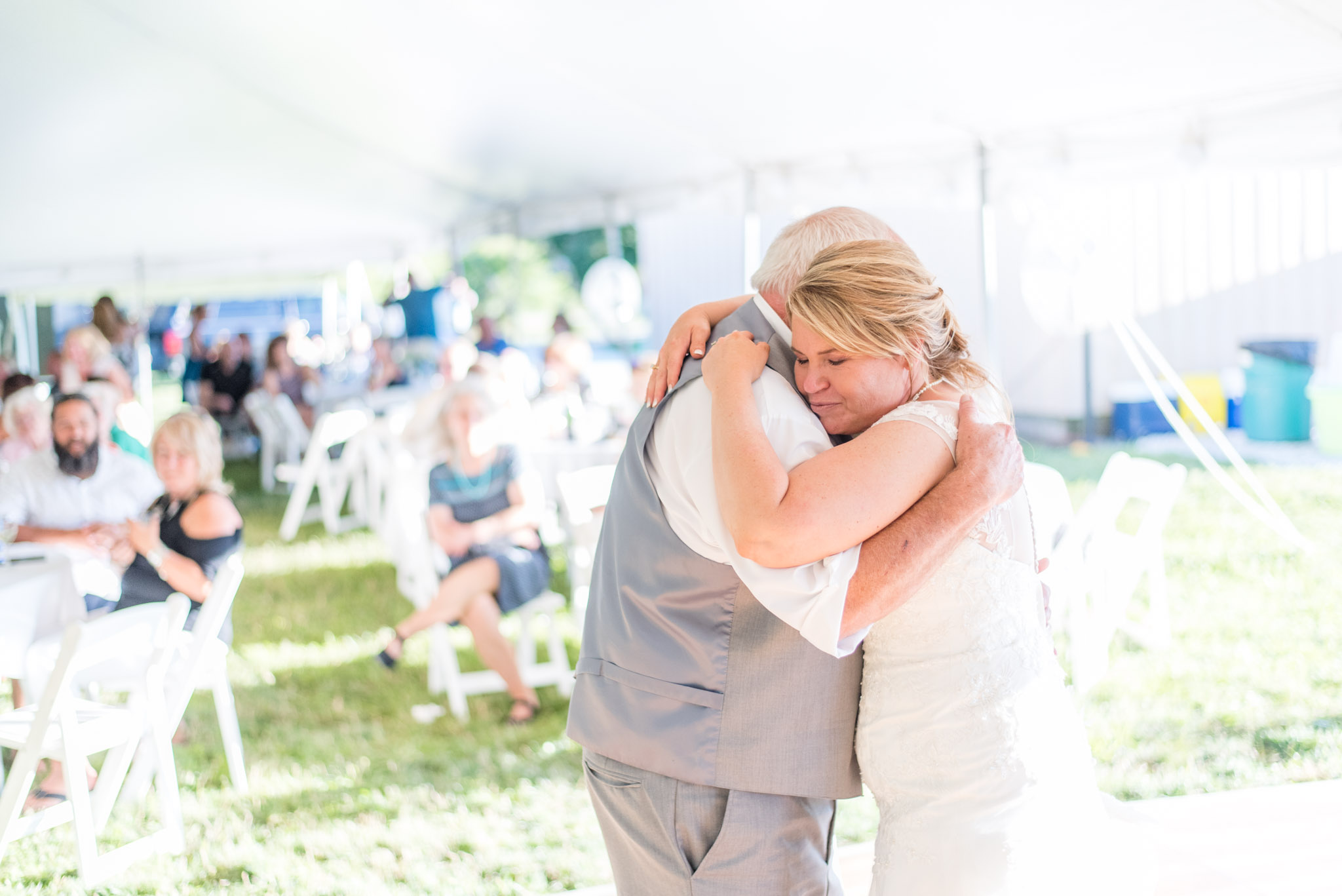 Father and Bride Hug During Wedding Reception