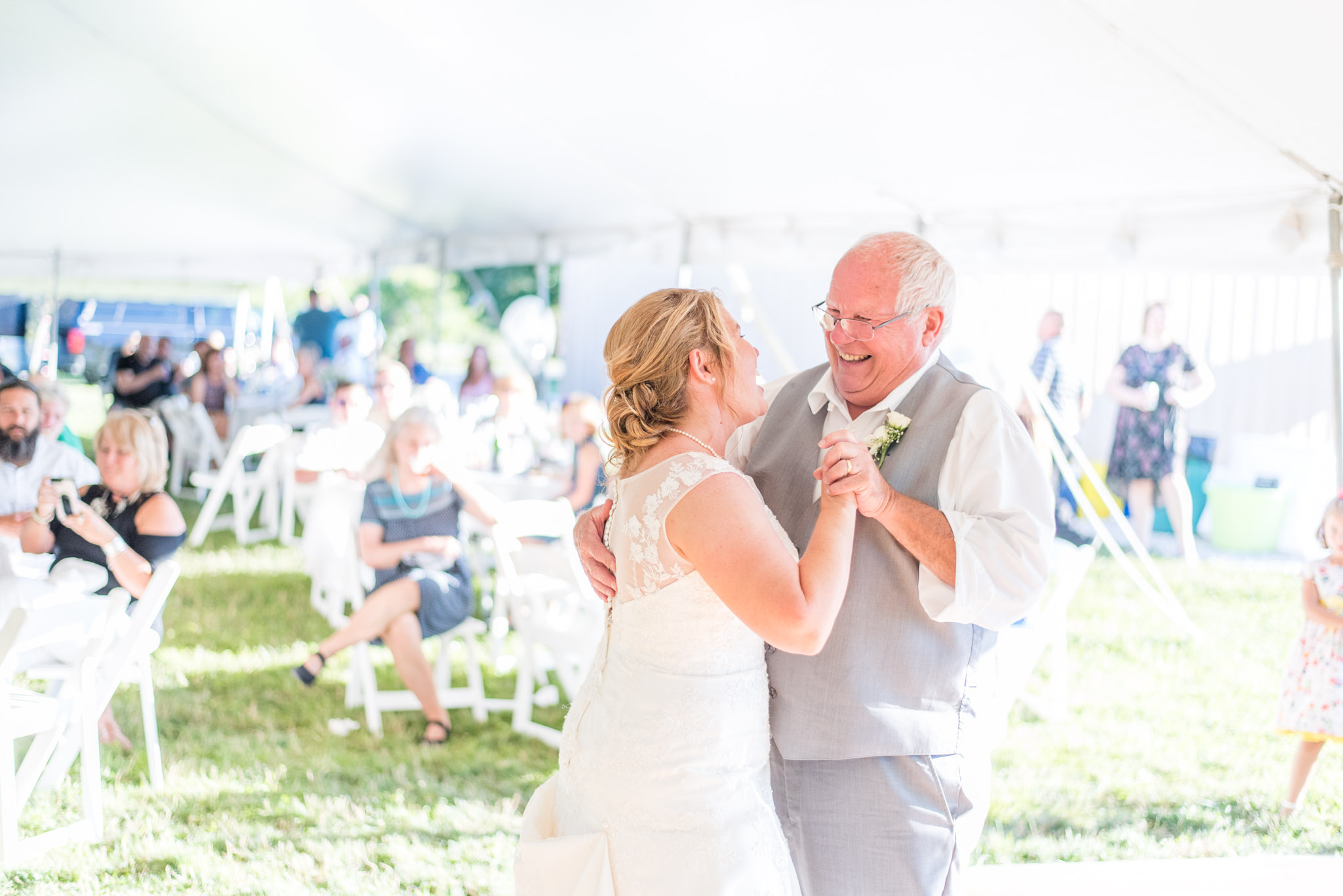 Father and Bride Laugh During Dance at Wedding Reception