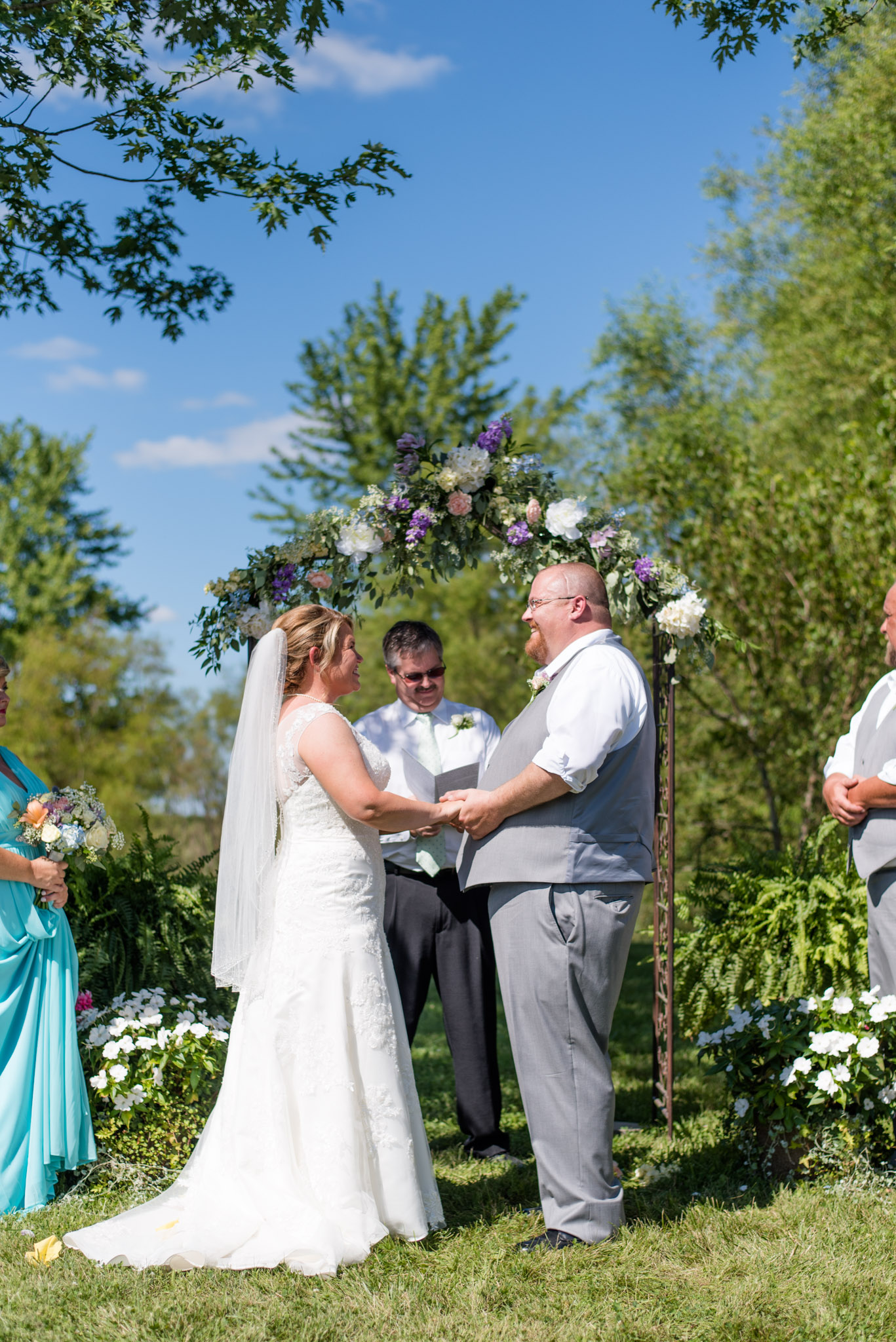Bride and Groom Smile at Each Other During Wedding Ceremony