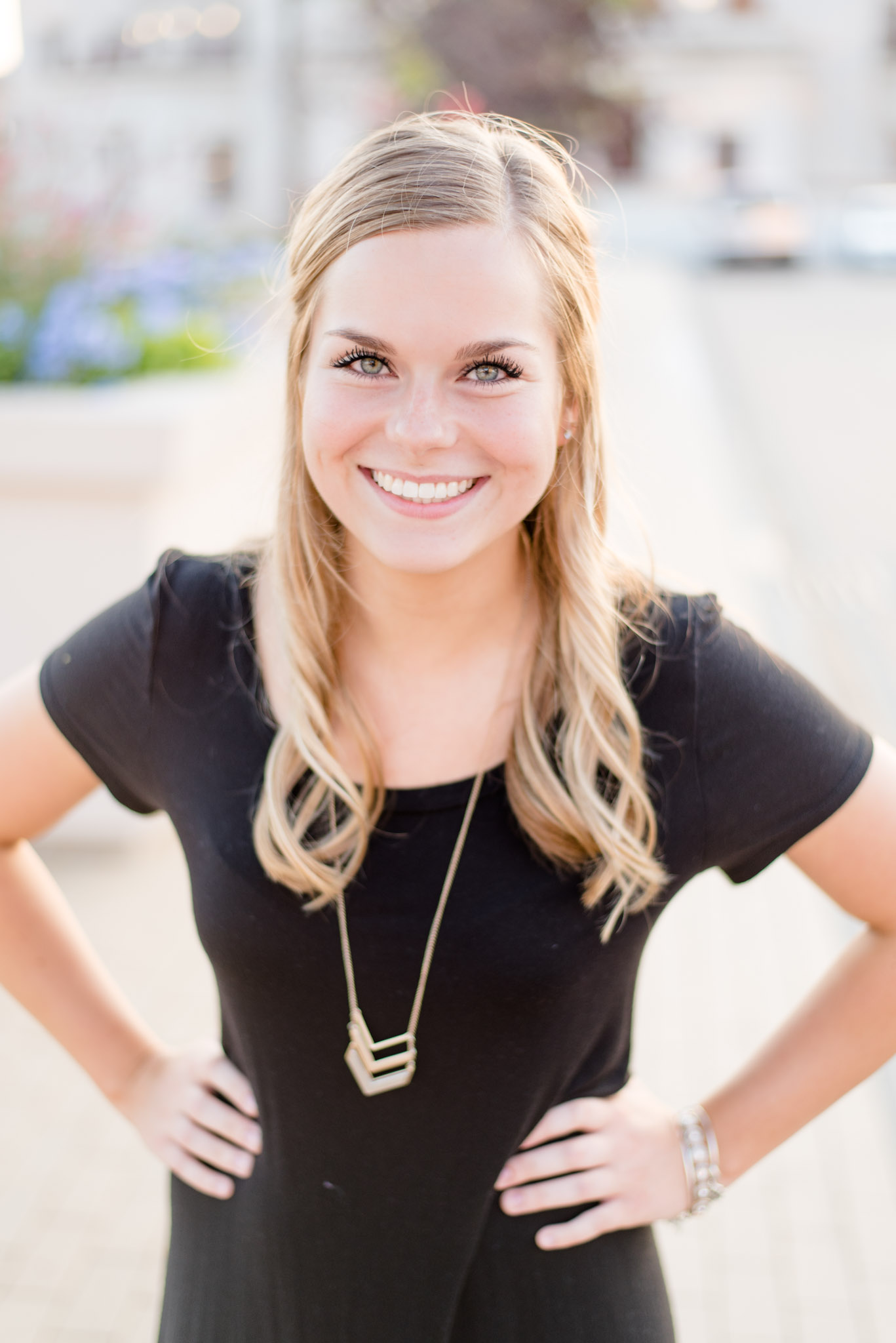 Headshot of Indianapolis realtor with hands on hips. 