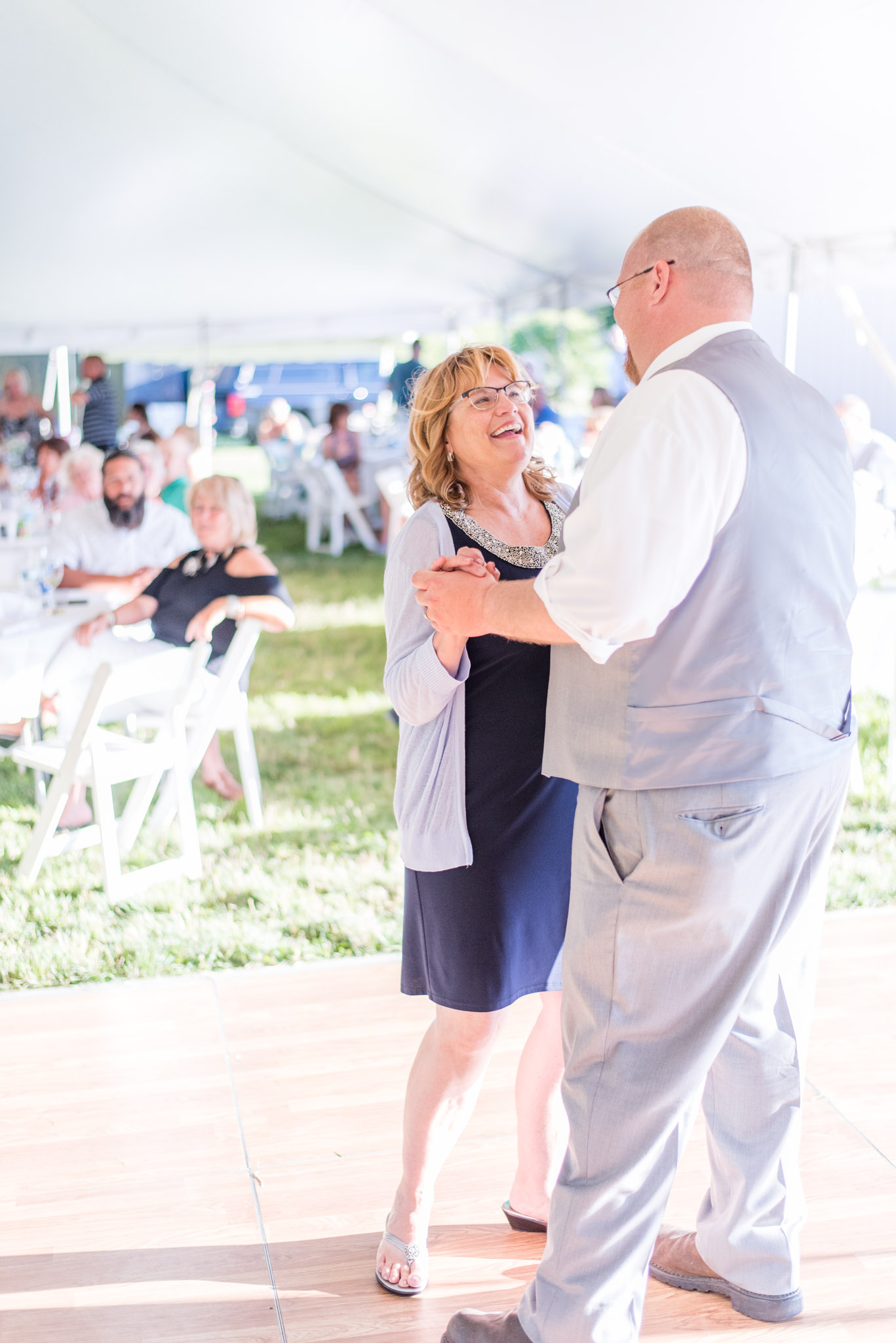 Mother of the Groom Laughs During Mother and Son Dance