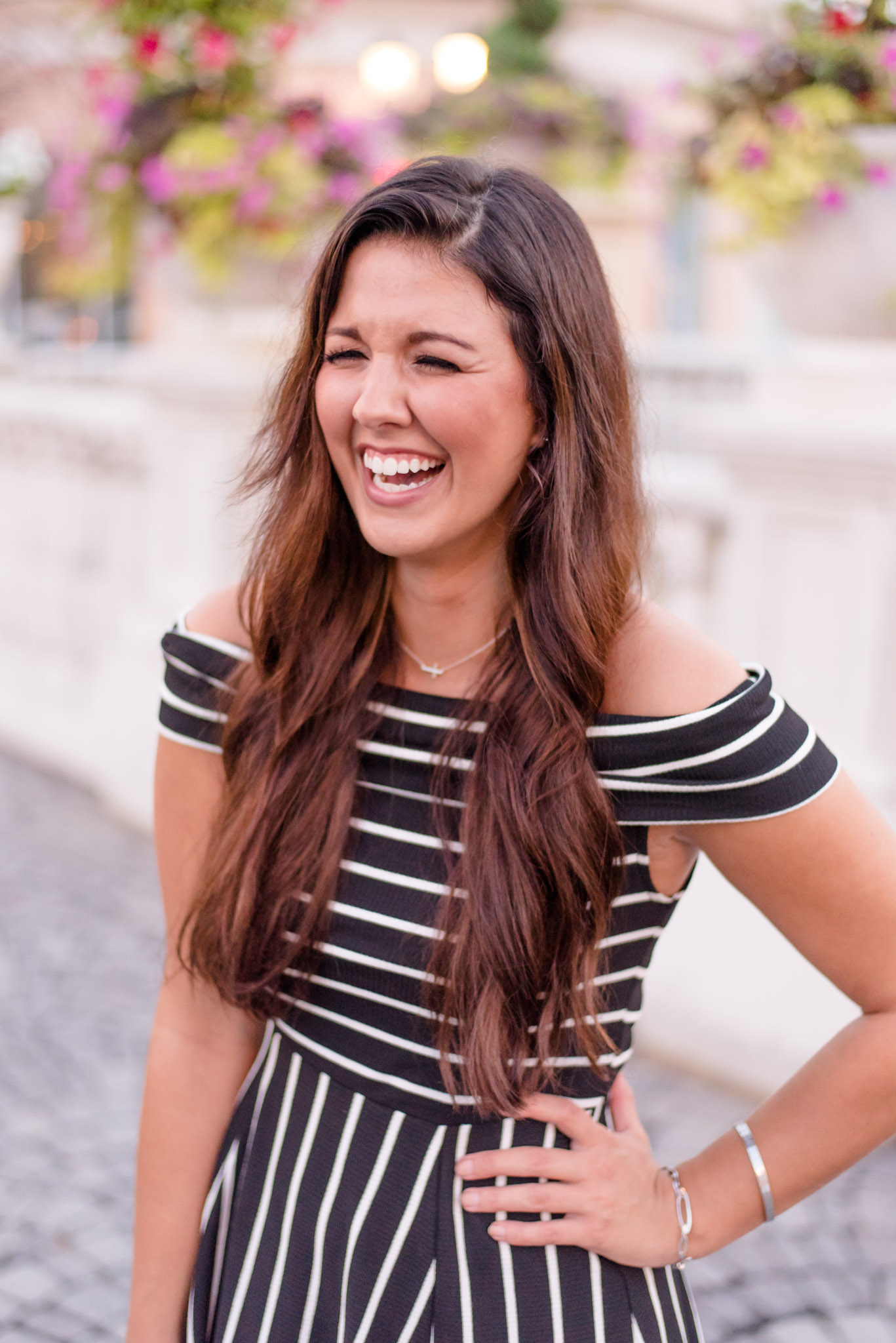 Girl laughs over shoulder at Bridge Street Town Centre.