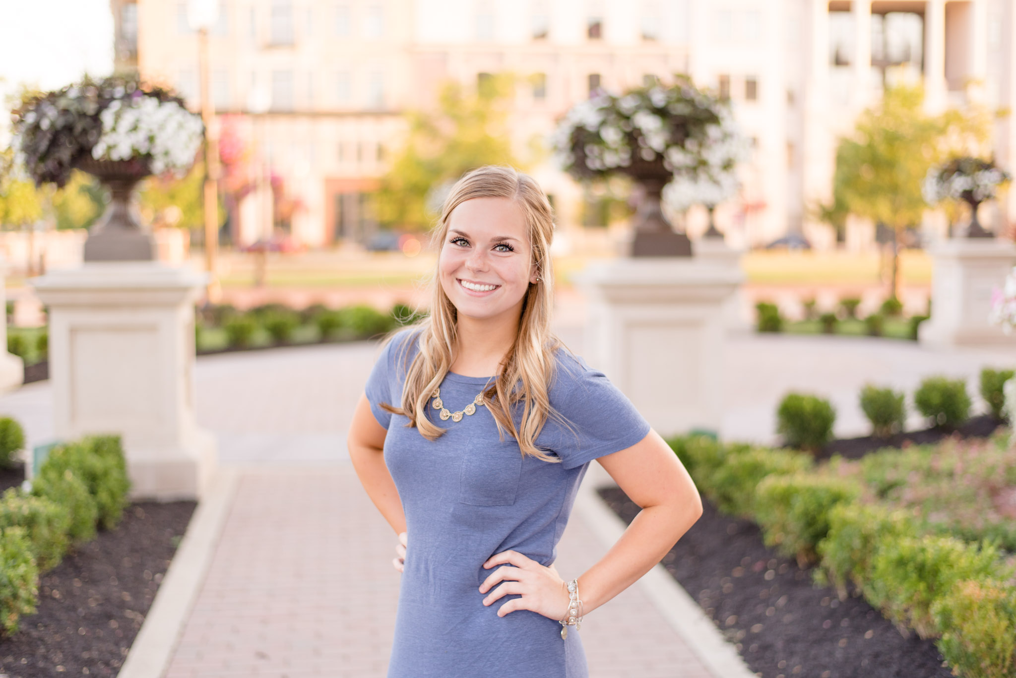 Maggie Mizell puts her hands on hips for headshots.