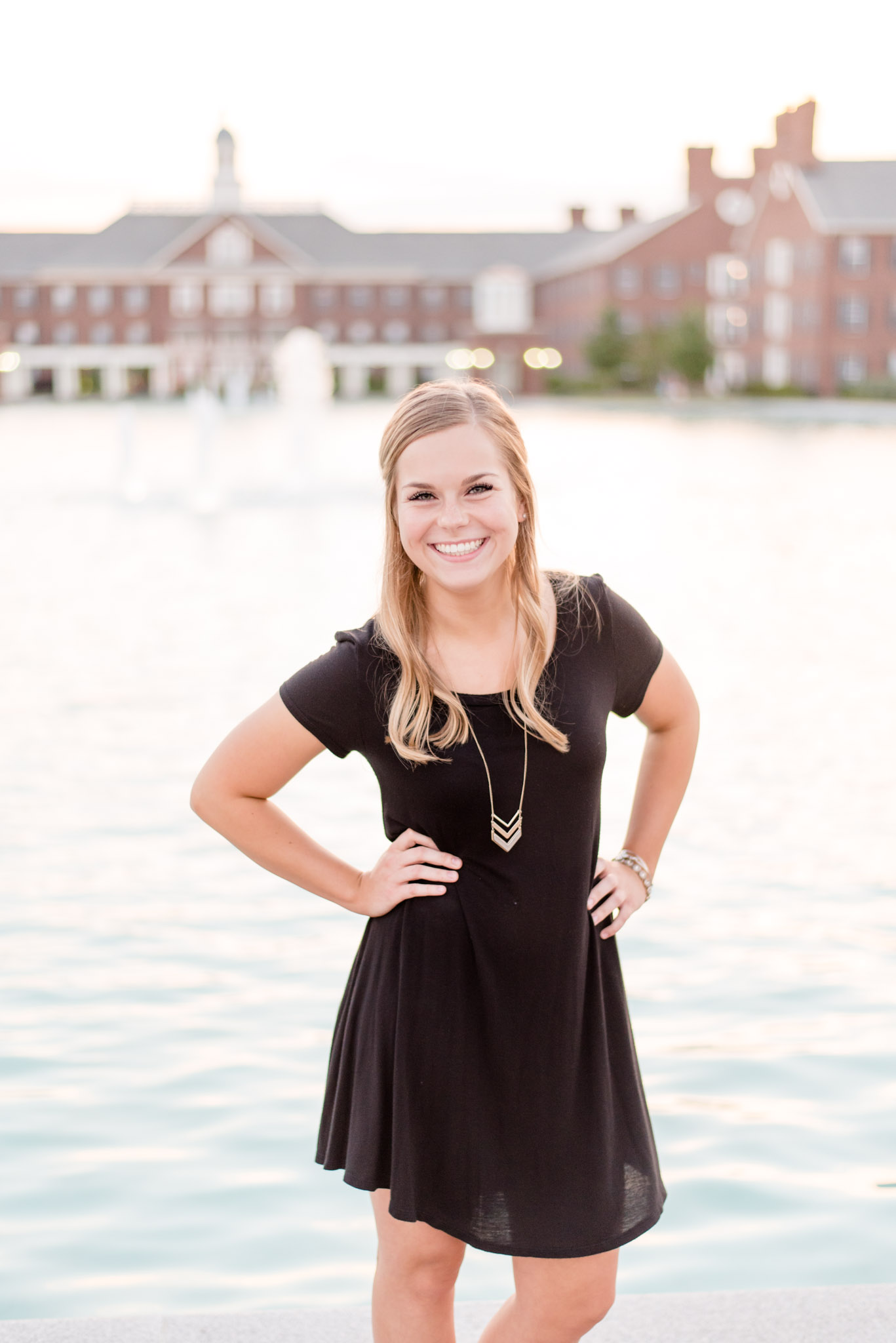 Maggie Mizell laughs at camera for realtor portraits. 