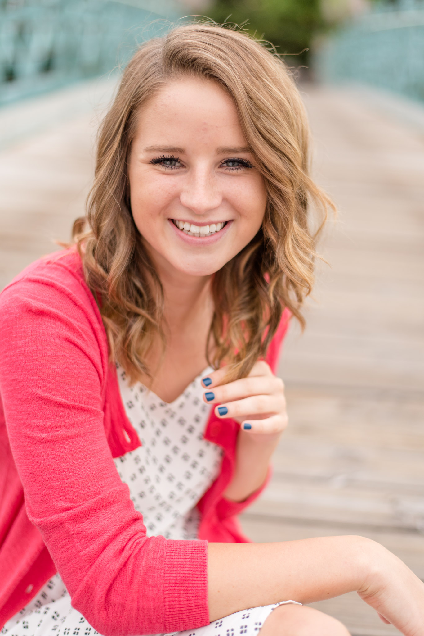 High School Senior sits on bridge in Indianapolis