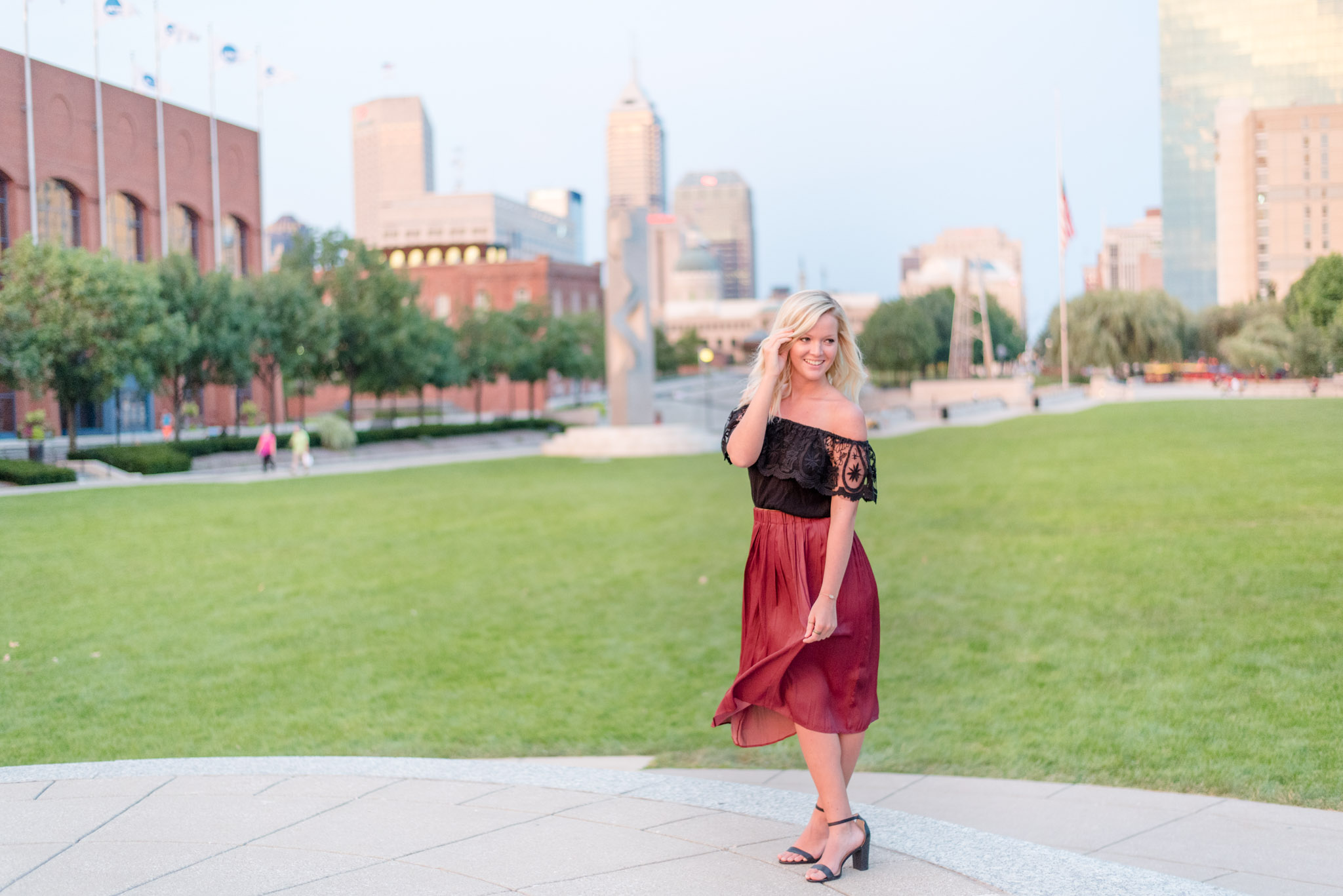 Indianapolis senior poses with cityscape.