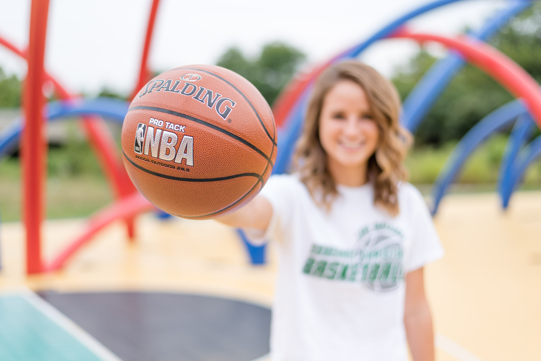 Senior holds basketball on Indianapolis court