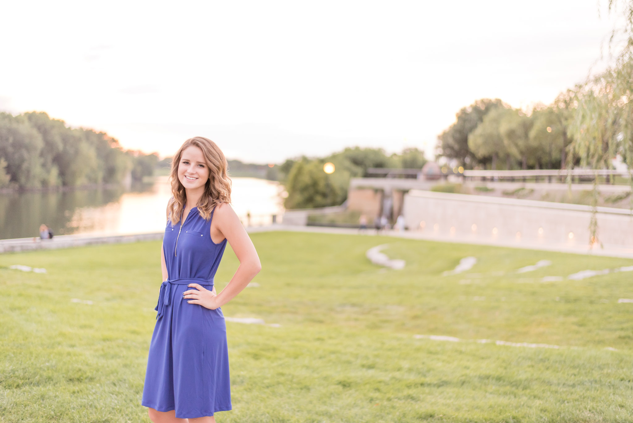 Indianapolis Senior Stands near river at sunset.