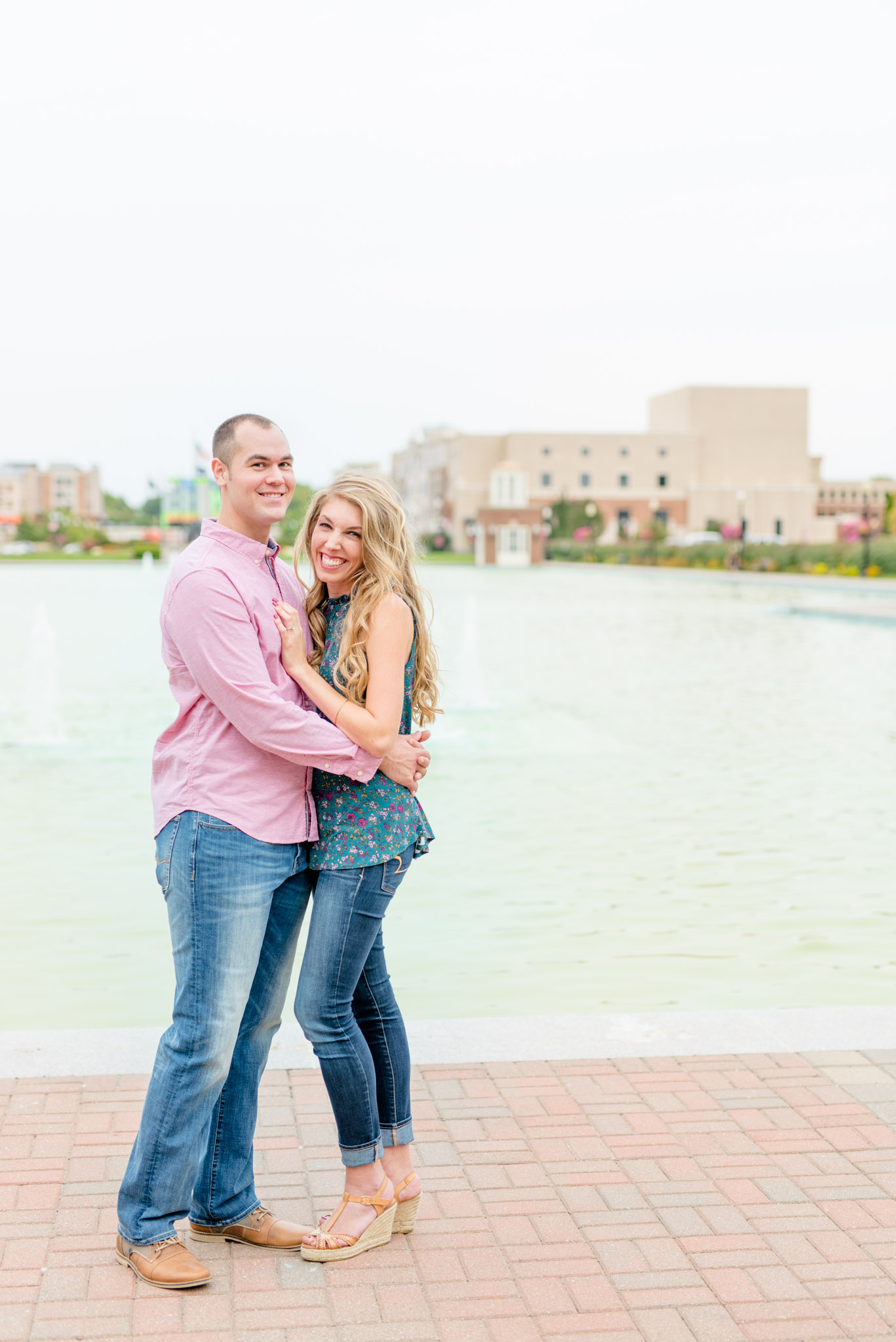 Indianapolis couple smile at the camera during engagement pictures.