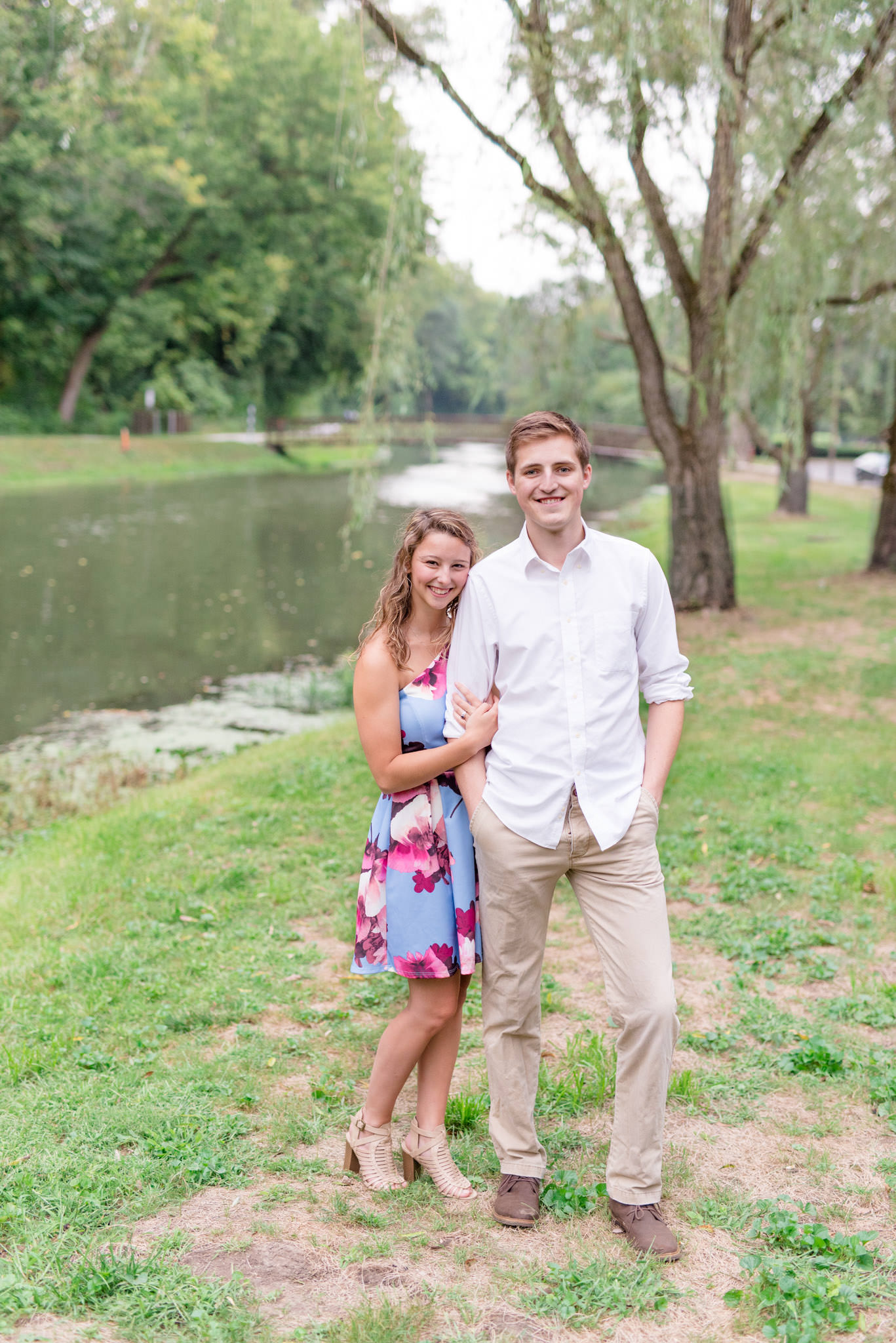 Butler University couple stands next to river.