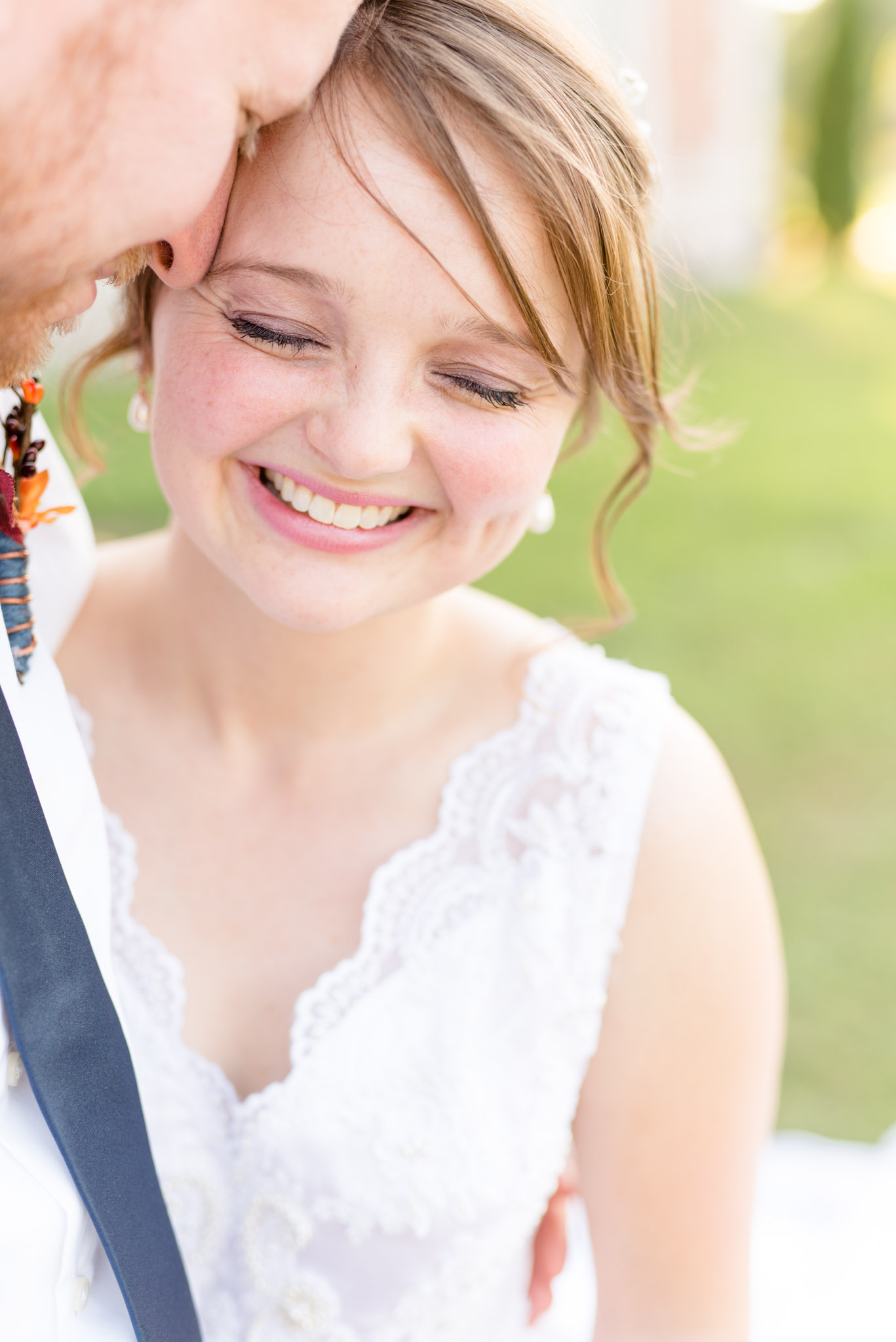 Bride Laughs While Hugging Groom