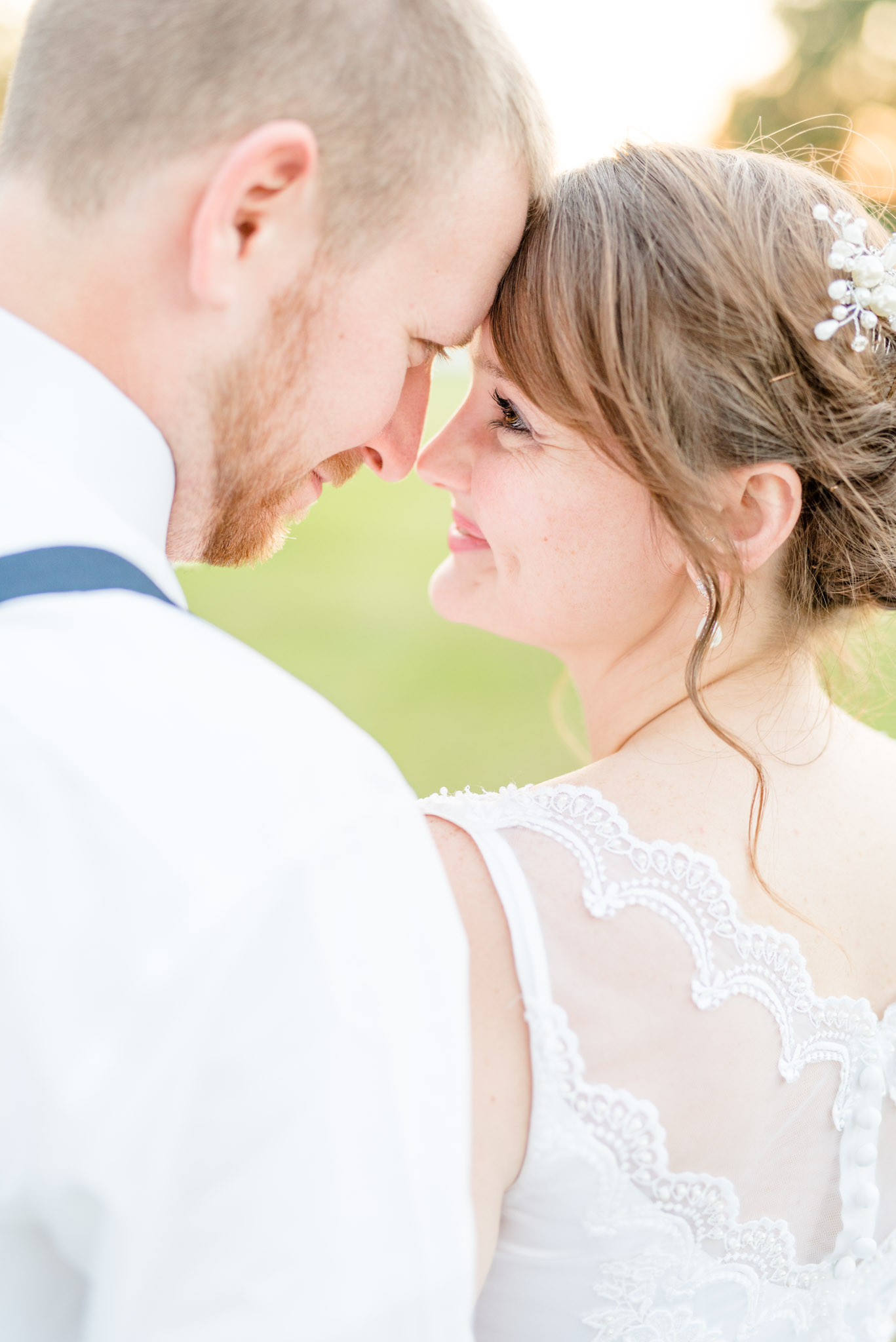 Bride and Groom Touch Noses and smile.