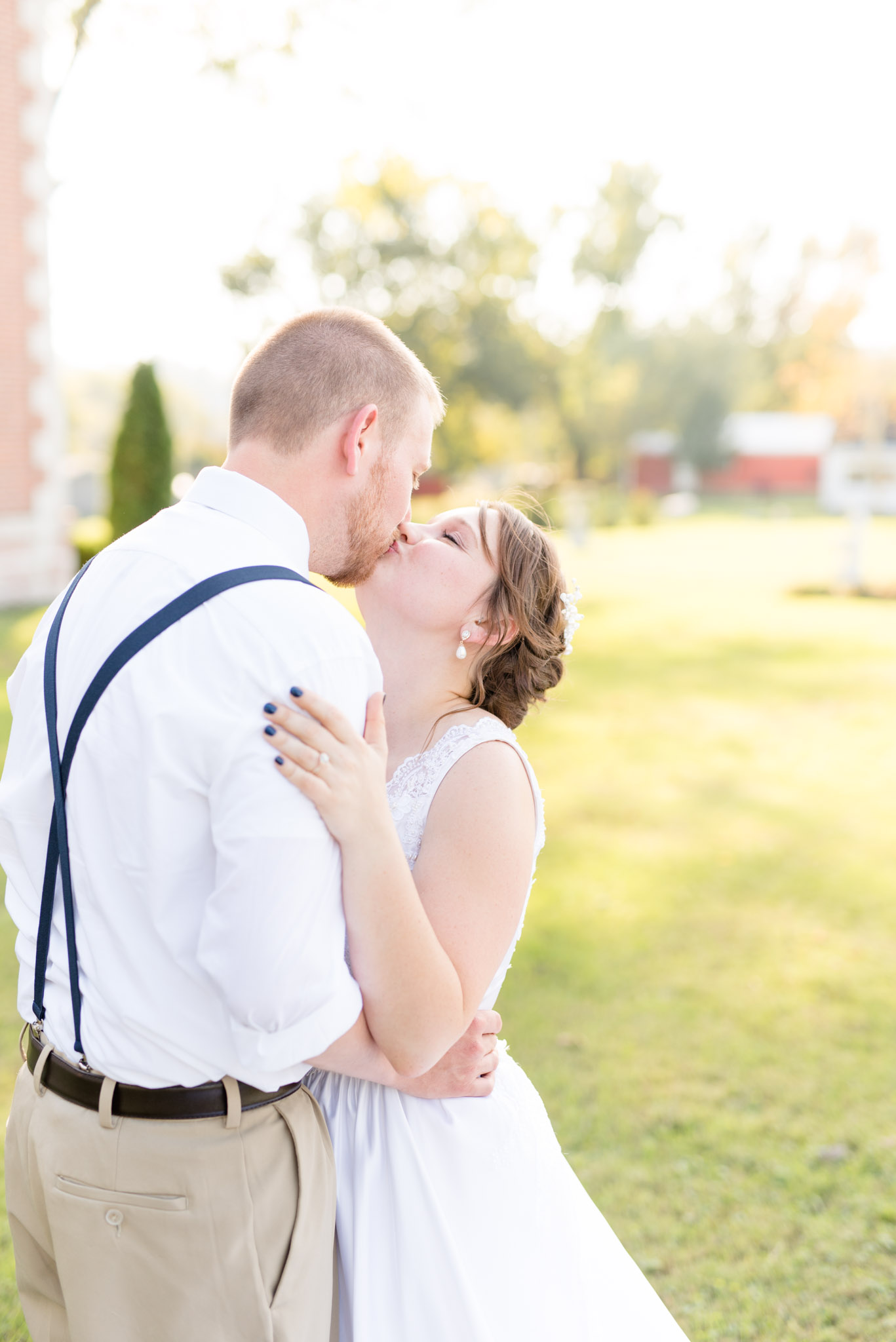 Bride and Groom kiss at sunset.