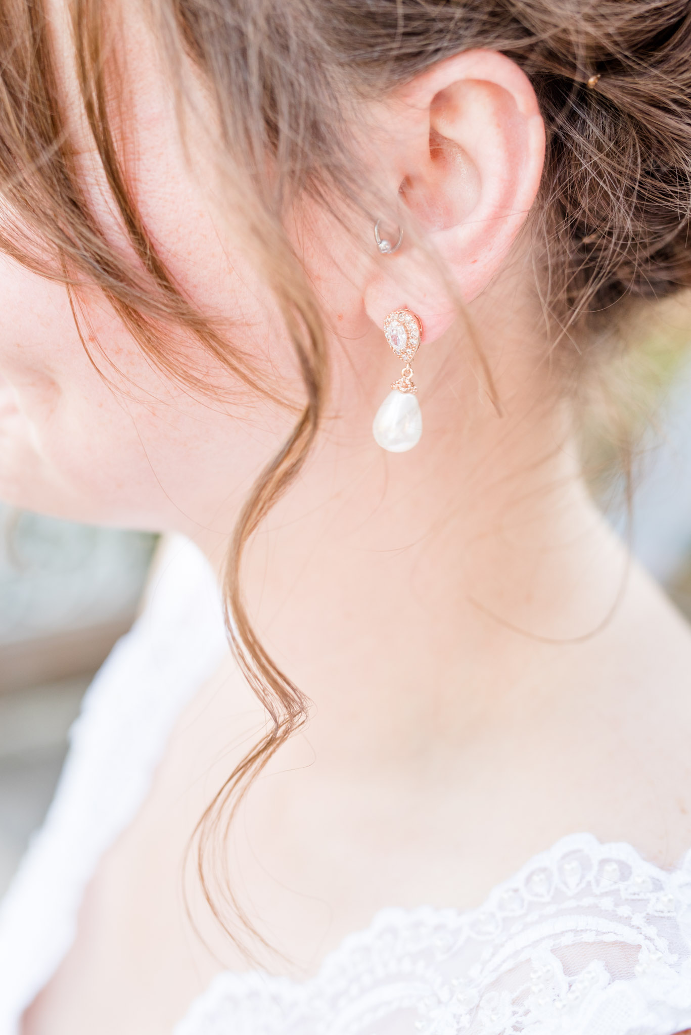 Bride's earring on wedding day.