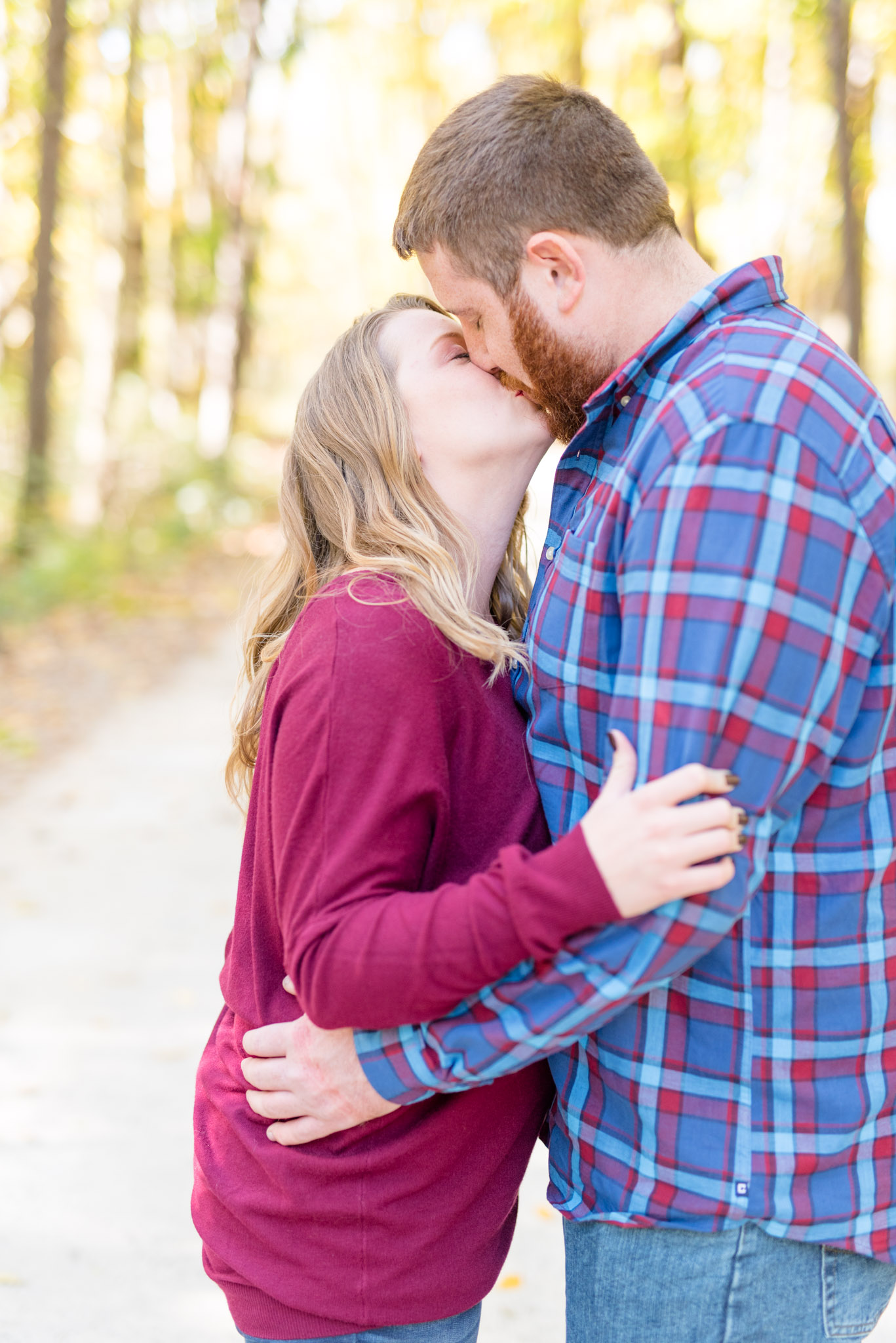 Couple kisses during engagement session.