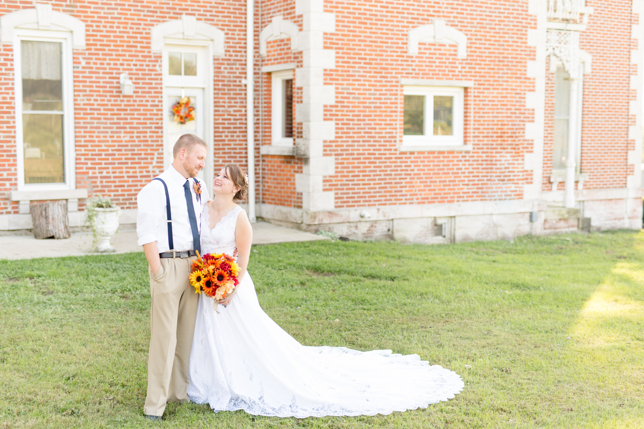 Bride and groom pose for wedding pictures.