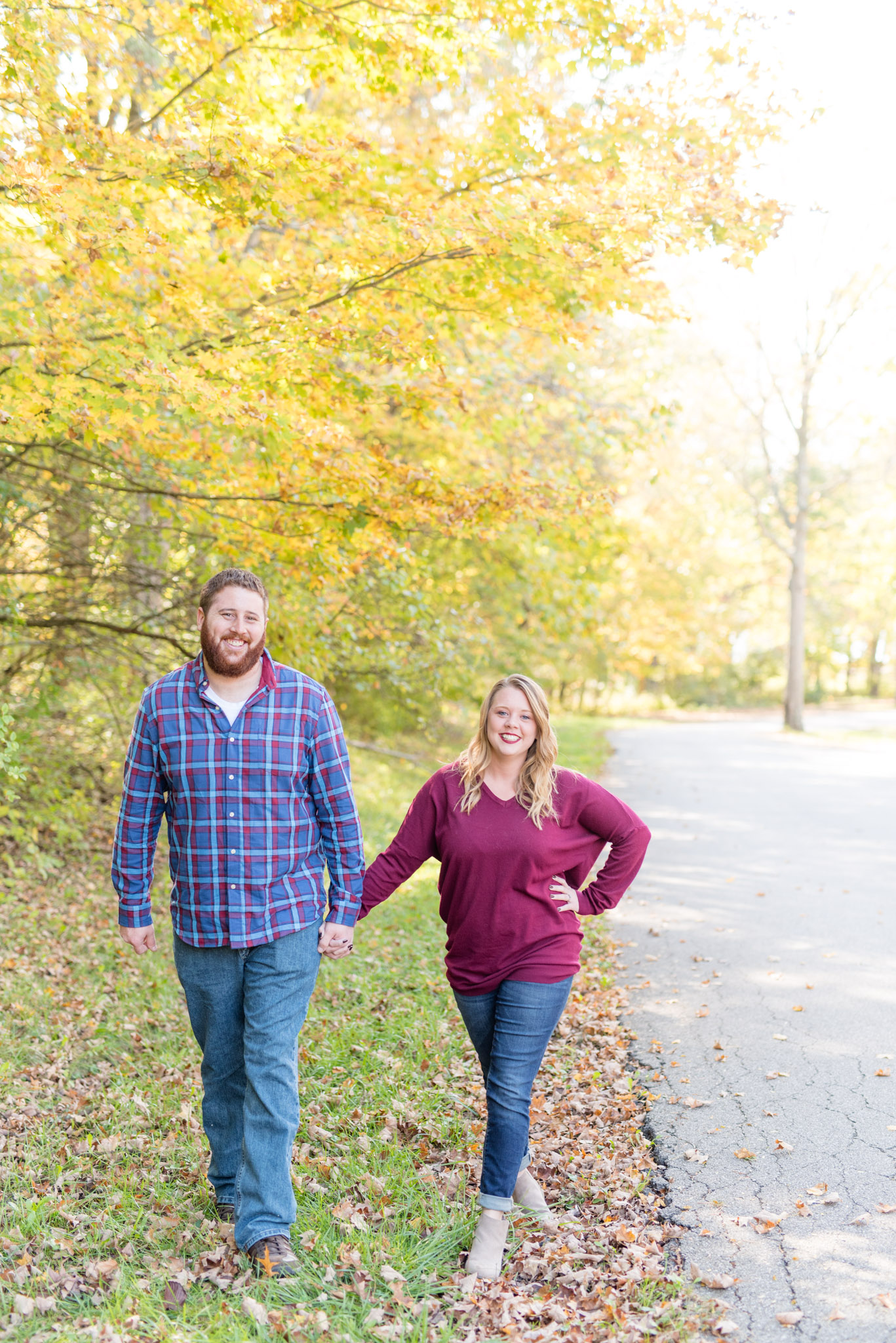 Couple walks during Eagle Creek State Park Engagement Session