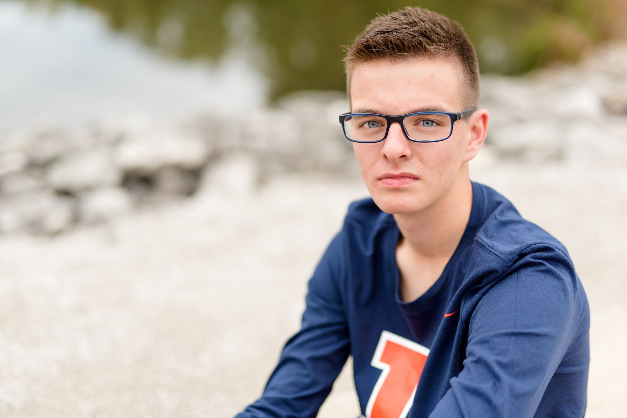 High school senior looks at camera for pictures.