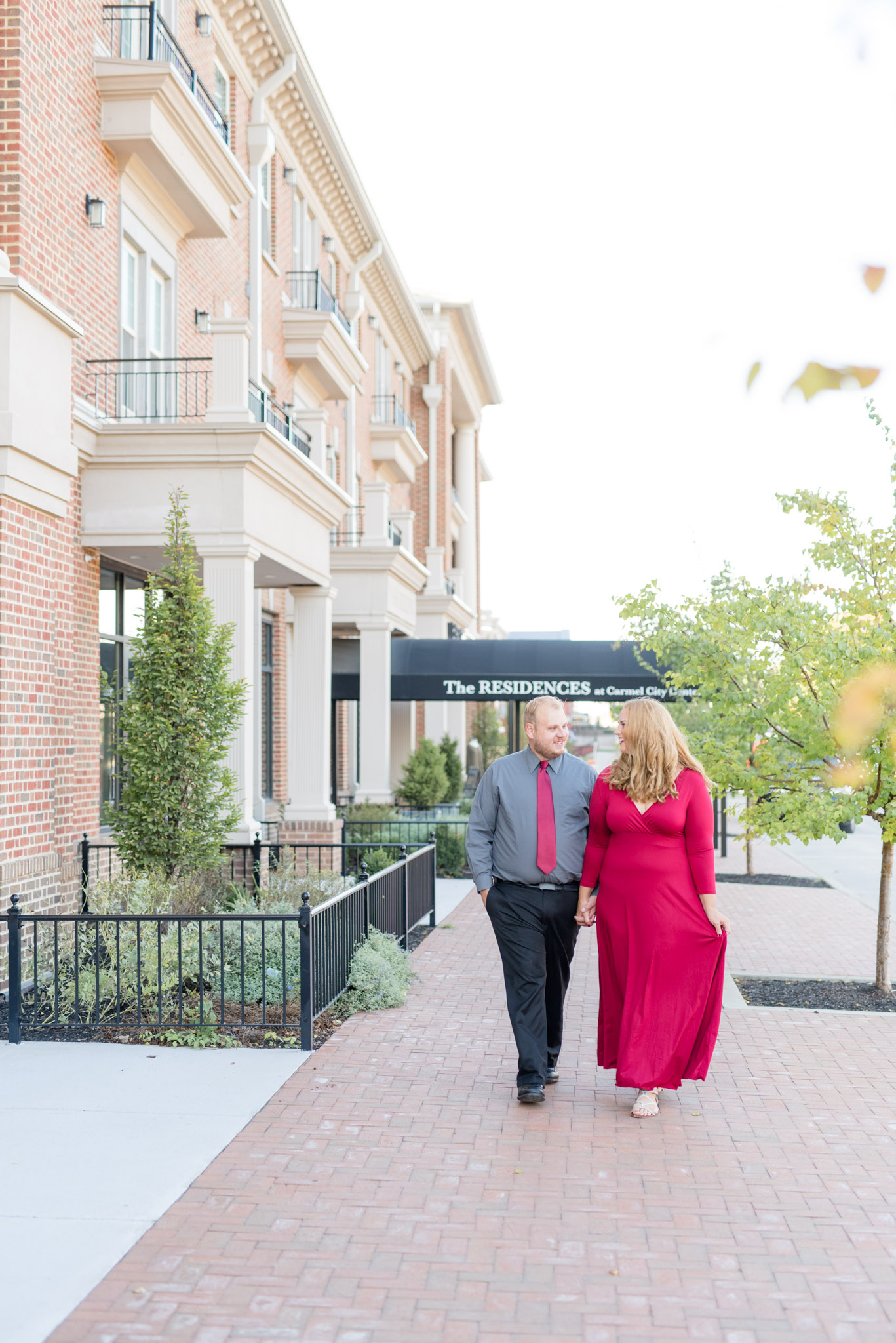 Engaged Couple Walking Down Urban Path