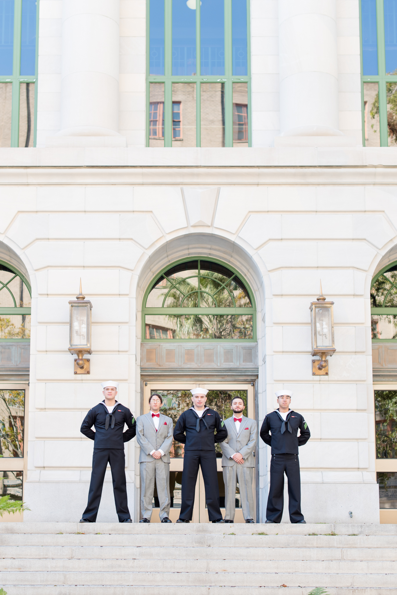 Groomsmen stand in front of Orange County Regional History Center