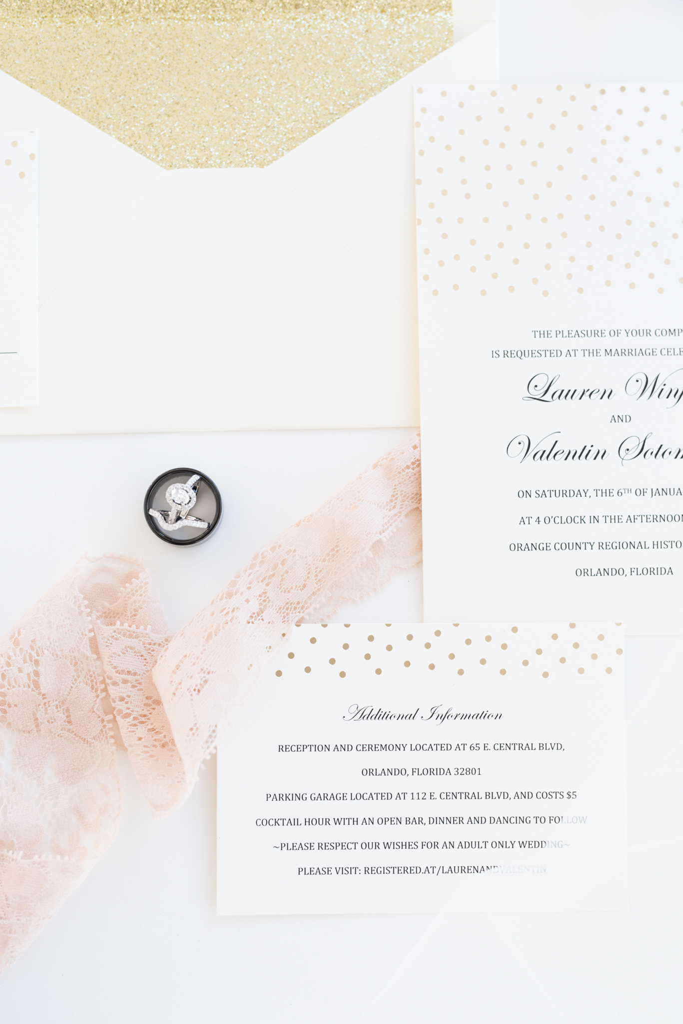 Wedding Invitation suite sits on table.