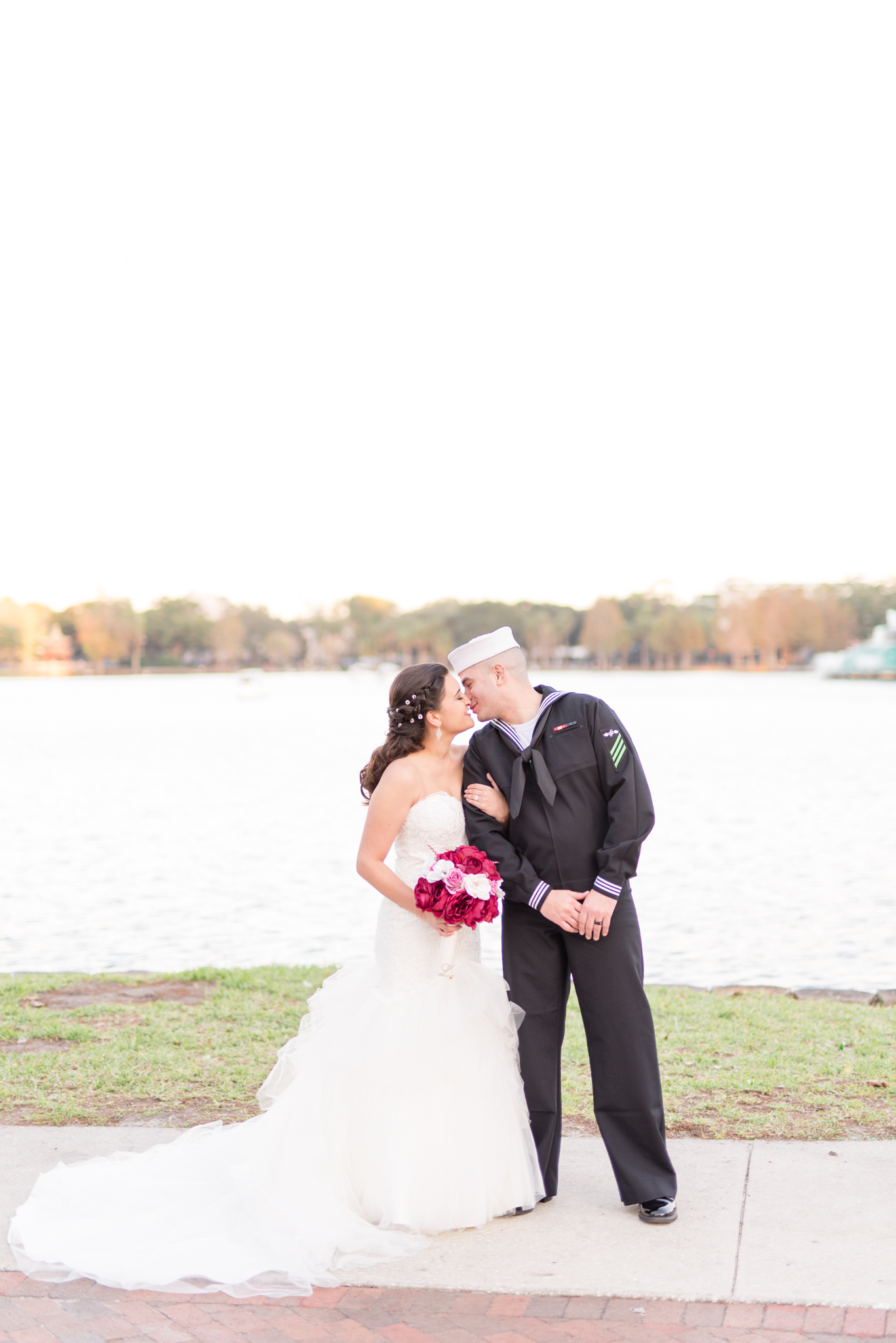Bride and Groom kiss during Lake Eola wedding portraits.
