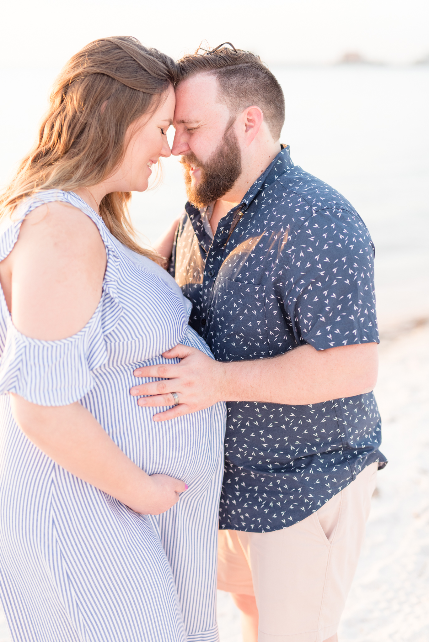 Couple Standing on Beach Touches Foreheads