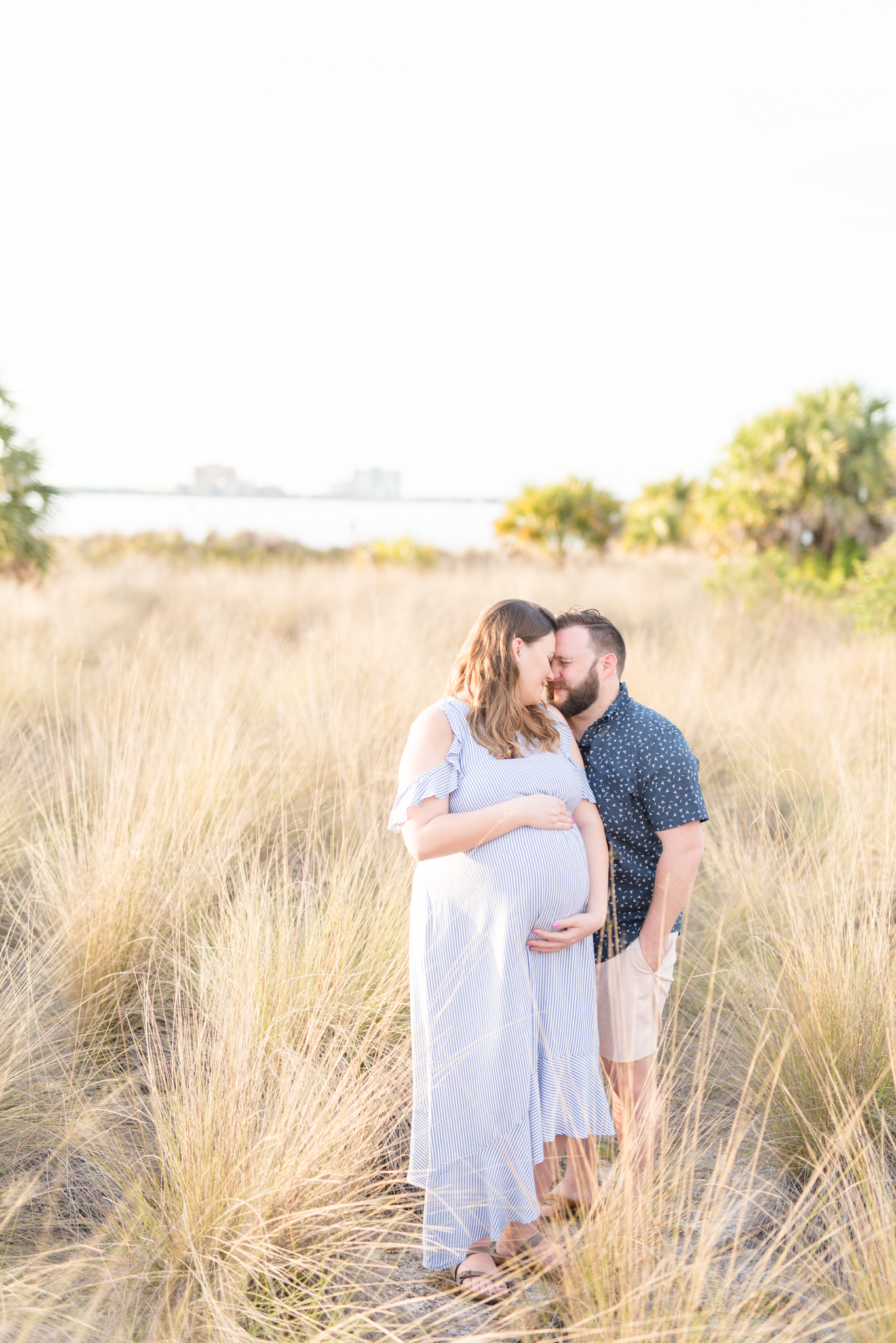 Tampa couple snuggles during maternity pictures.