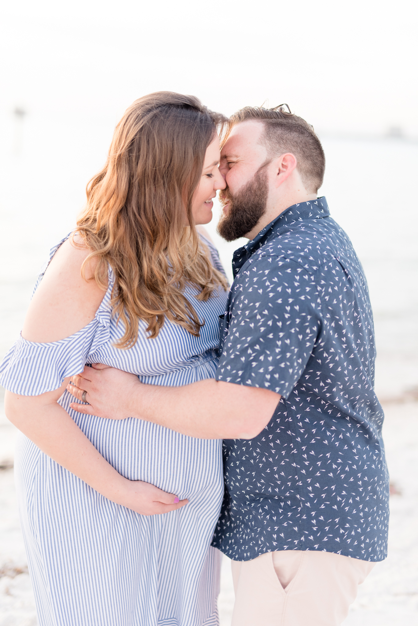 Couple kisses during Tampa Maternity Session.