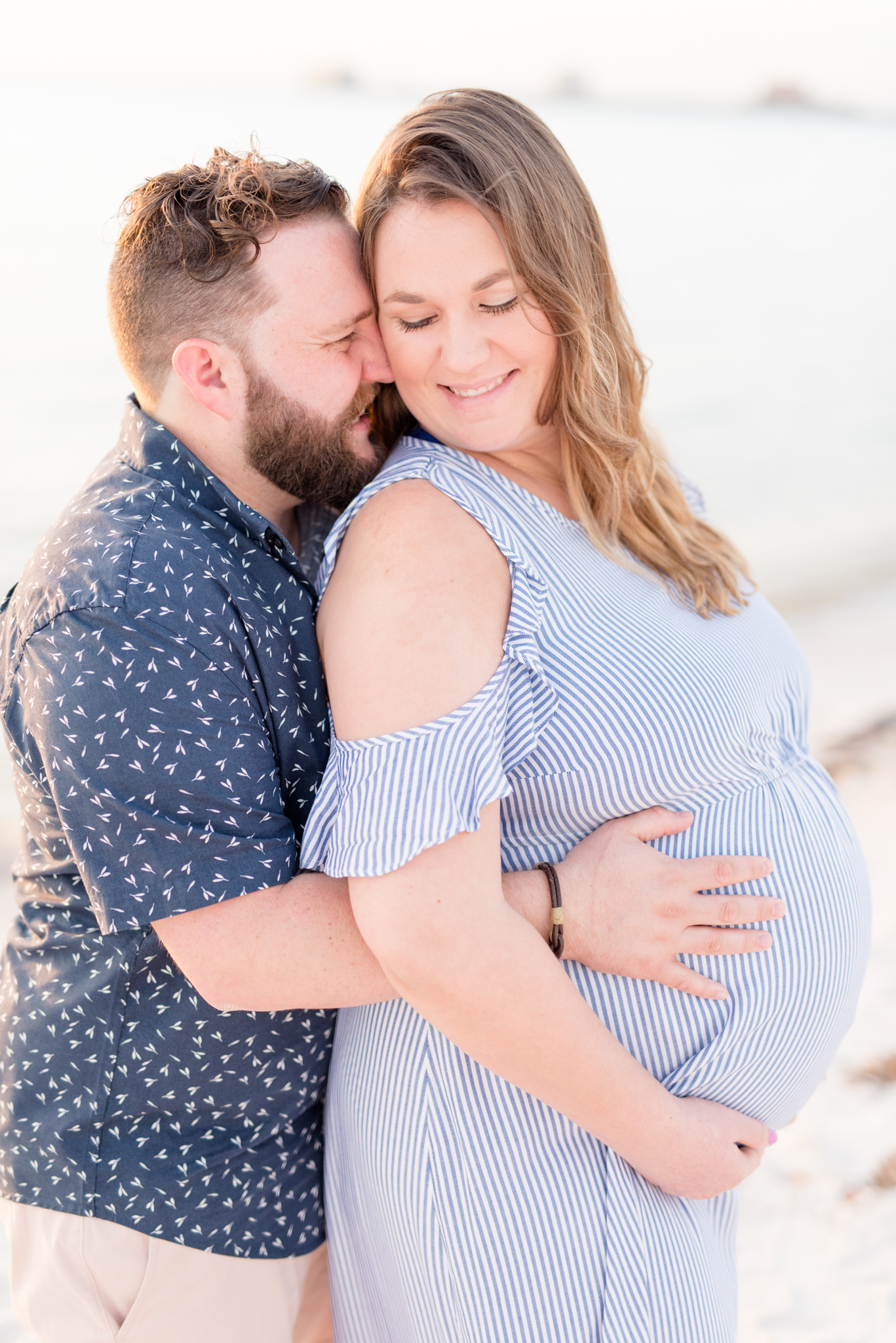 Tampa couple smiles during maternity session.