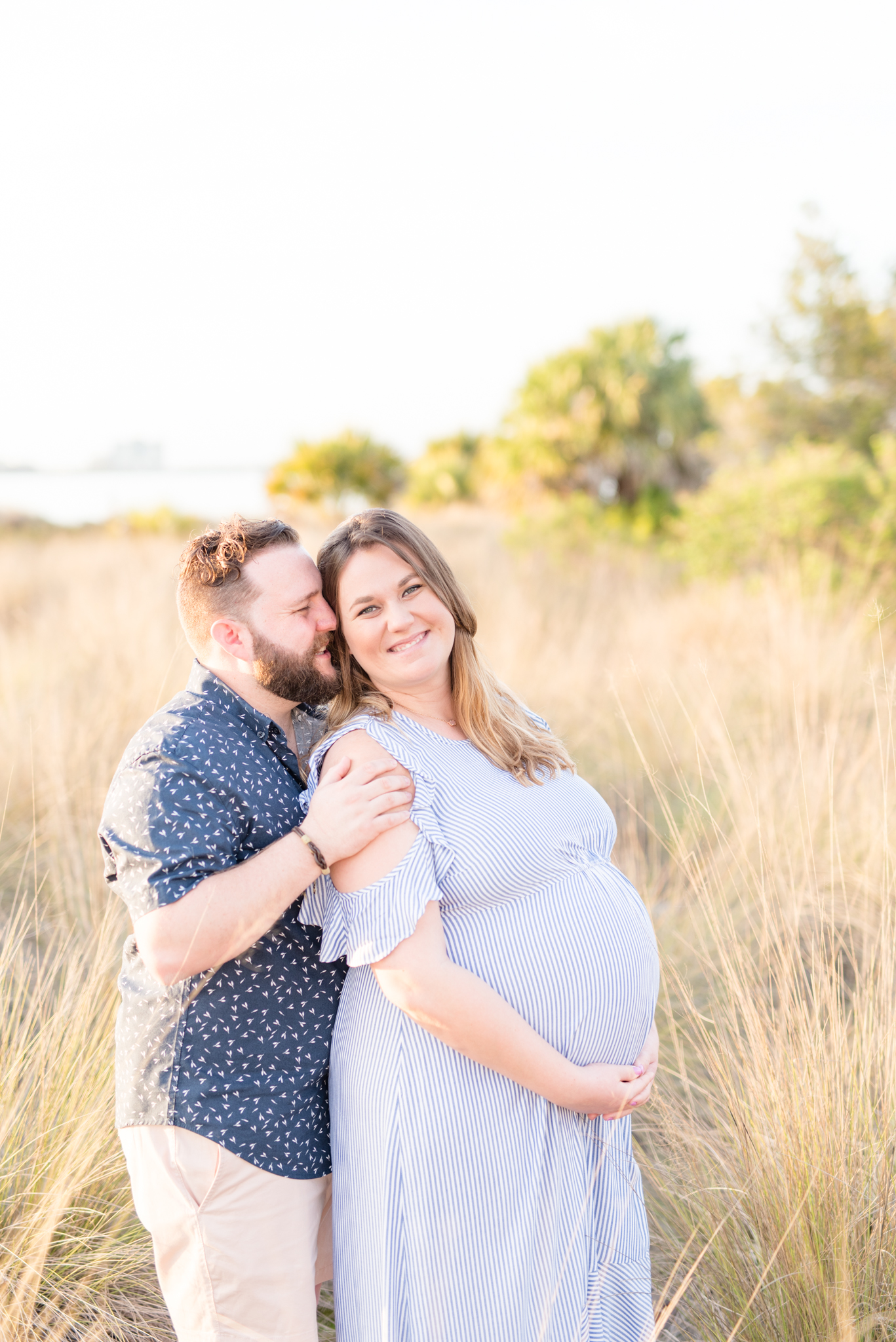 Expecting couple smiles during maternity session.