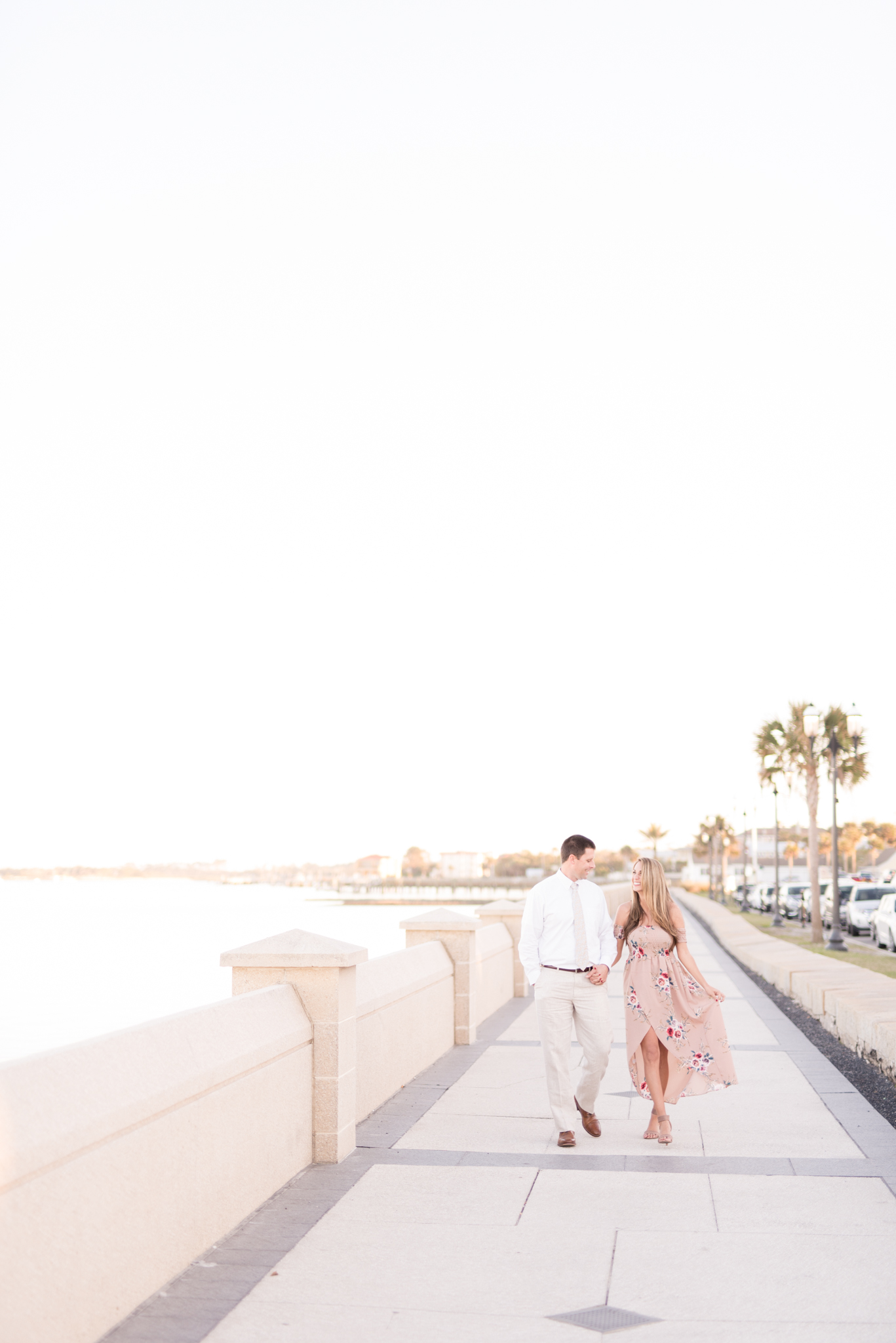 Married couple walk along the St. Augustine Coast.