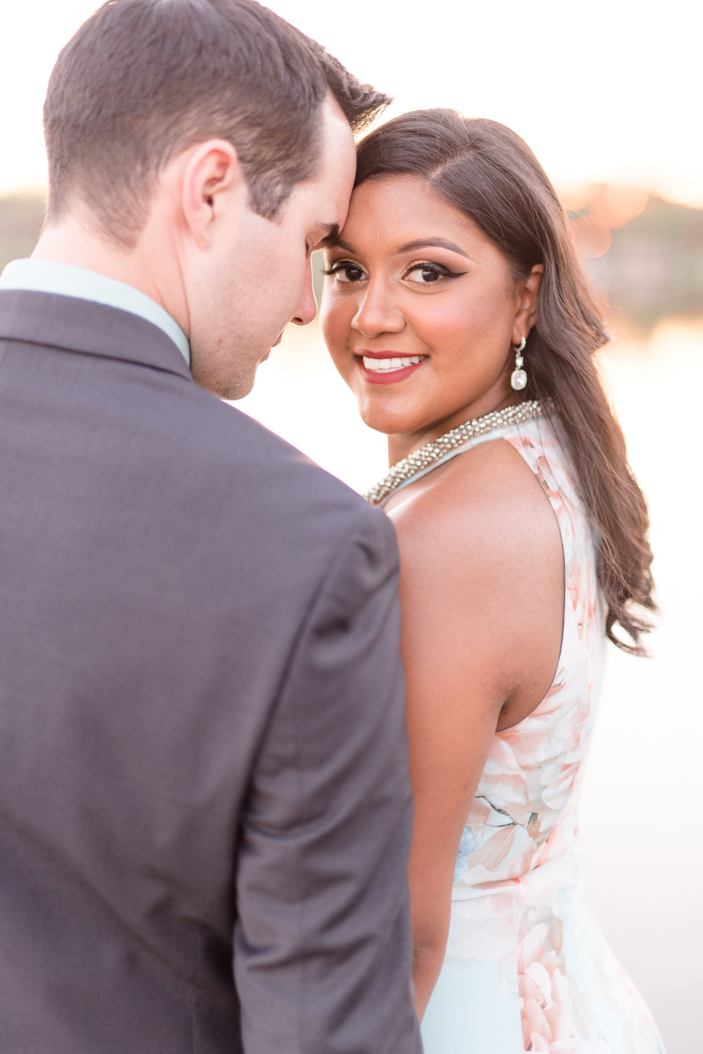 Bride-to-be smiles at camera.